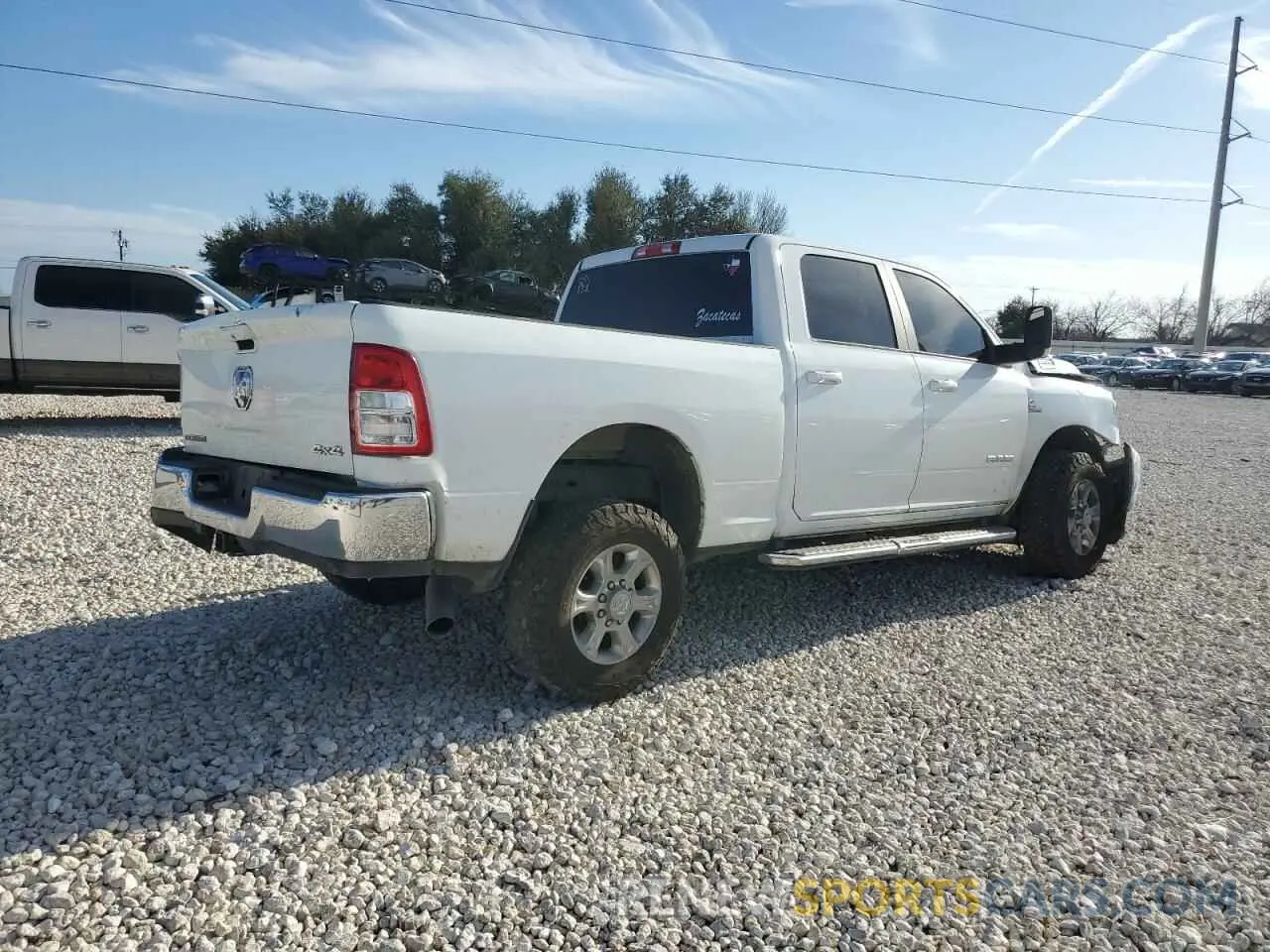 3 Photograph of a damaged car 3C6UR5DL0NG298052 RAM 2500 2022