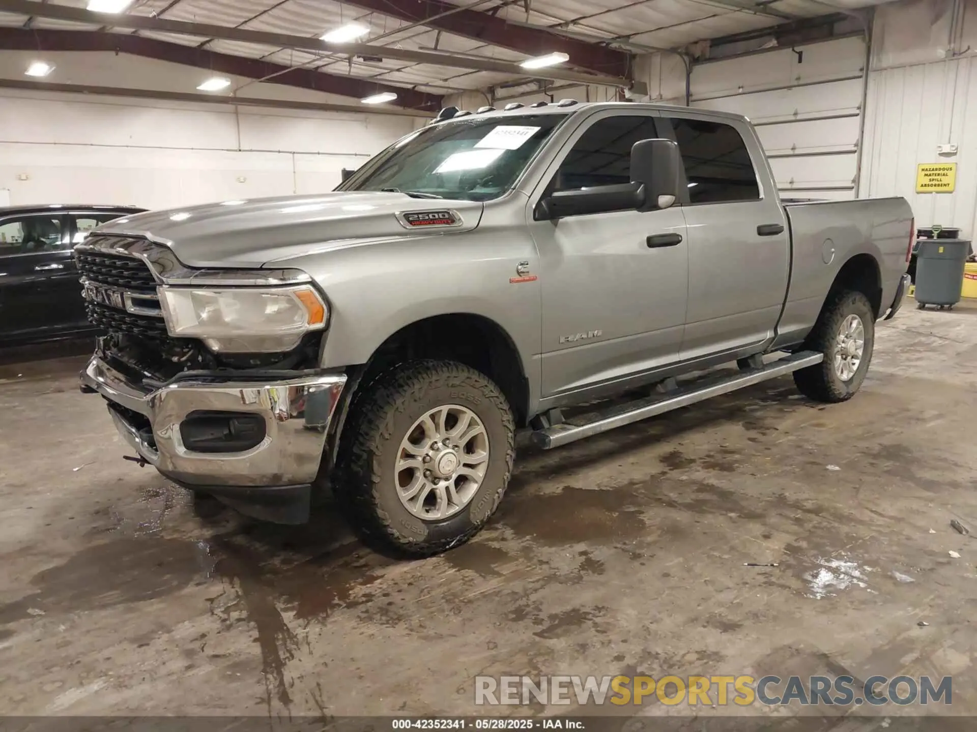2 Photograph of a damaged car 3C6UR5DL0NG370058 RAM 2500 2022
