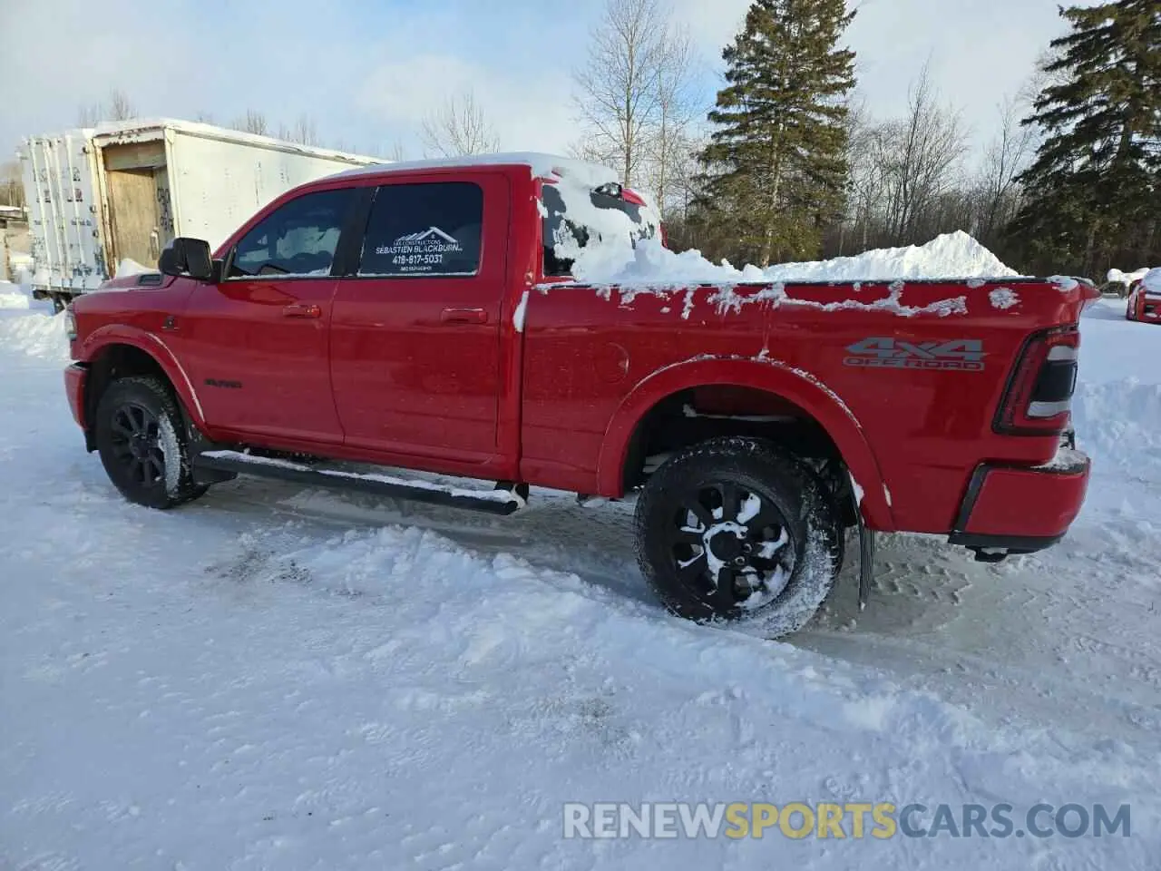 2 Photograph of a damaged car 3C6UR5DL0NG431036 RAM 2500 2022