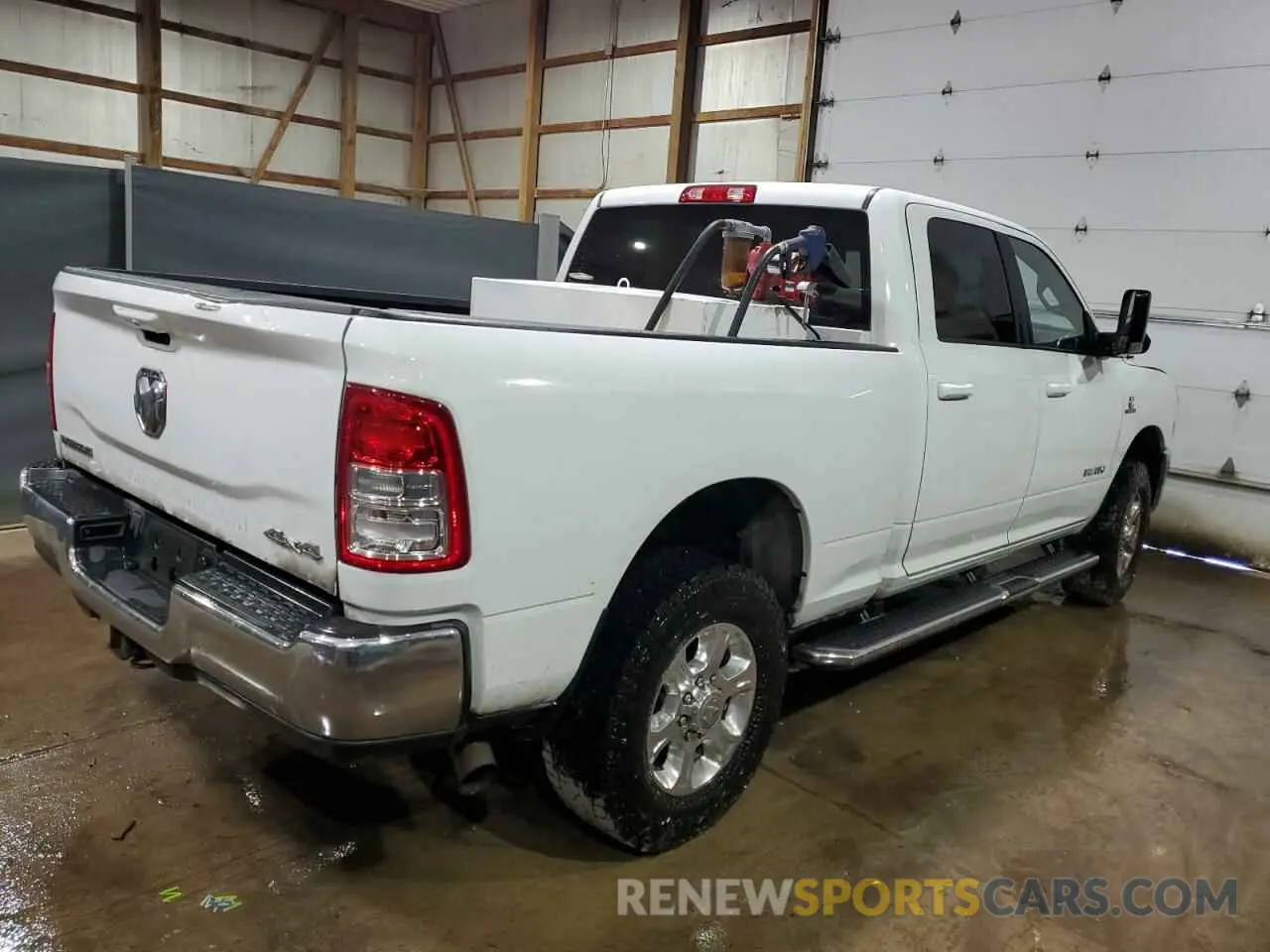 3 Photograph of a damaged car 3C6UR5DL1NG155465 RAM 2500 2022