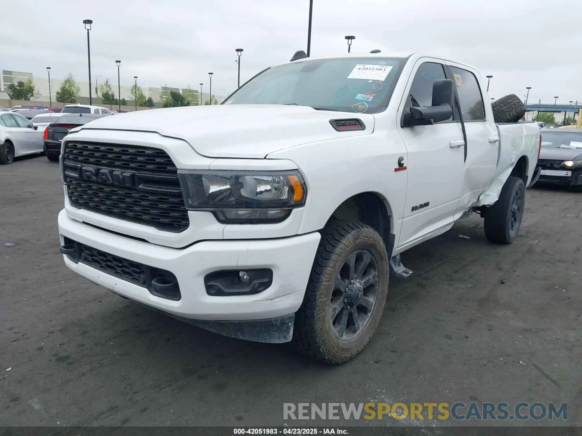 2 Photograph of a damaged car 3C6UR5DL1NG157135 RAM 2500 2022