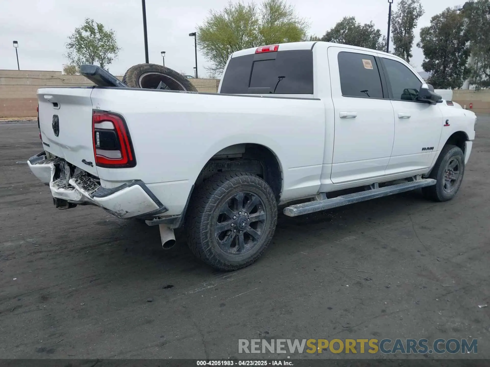 4 Photograph of a damaged car 3C6UR5DL1NG157135 RAM 2500 2022