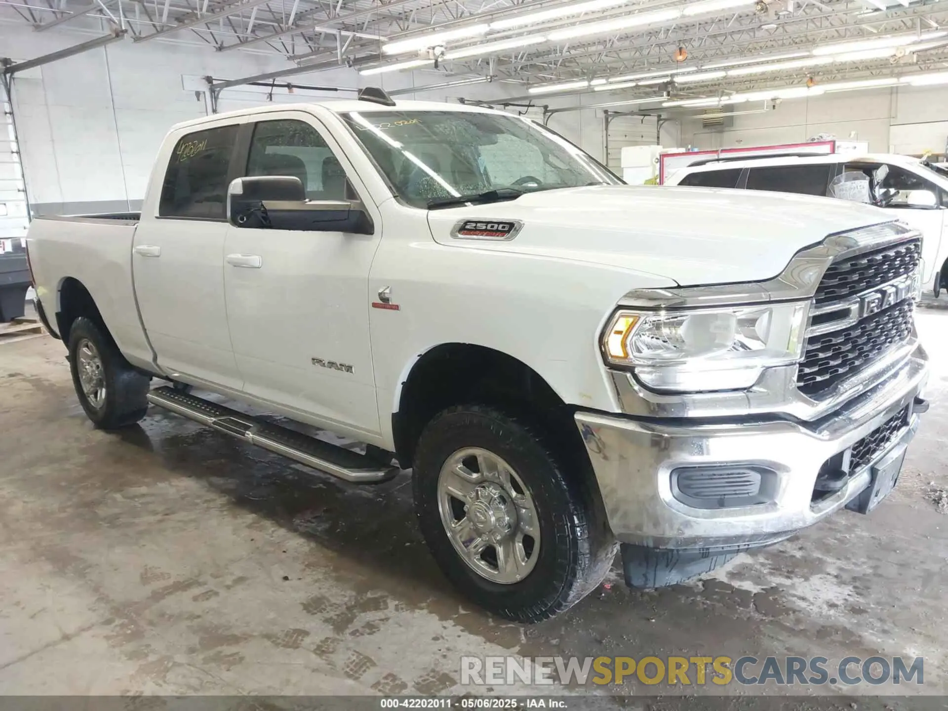 1 Photograph of a damaged car 3C6UR5DL1NG436374 RAM 2500 2022