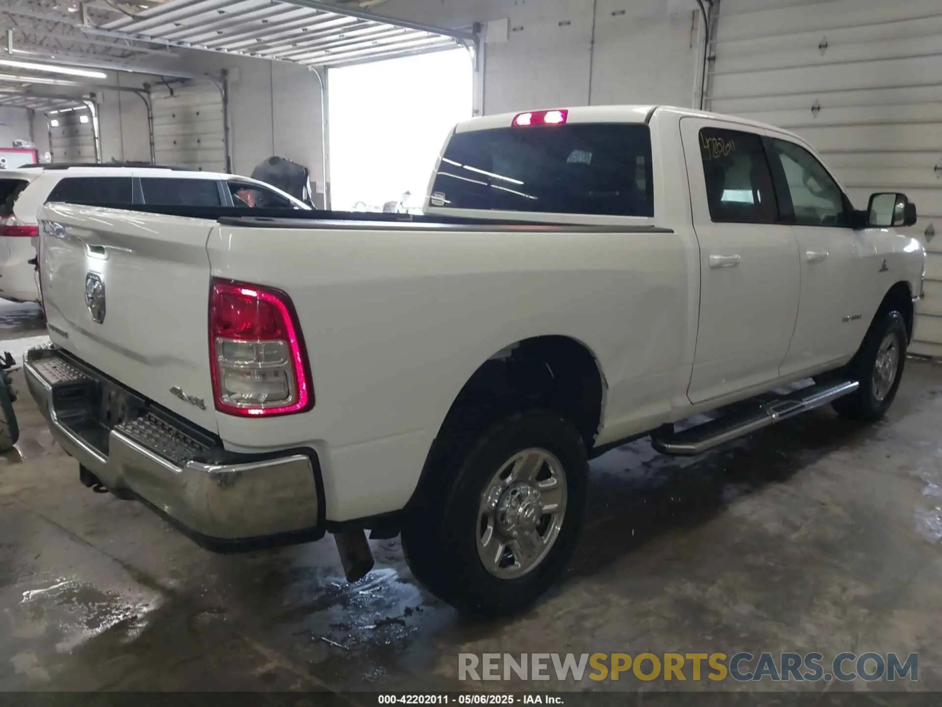 4 Photograph of a damaged car 3C6UR5DL1NG436374 RAM 2500 2022
