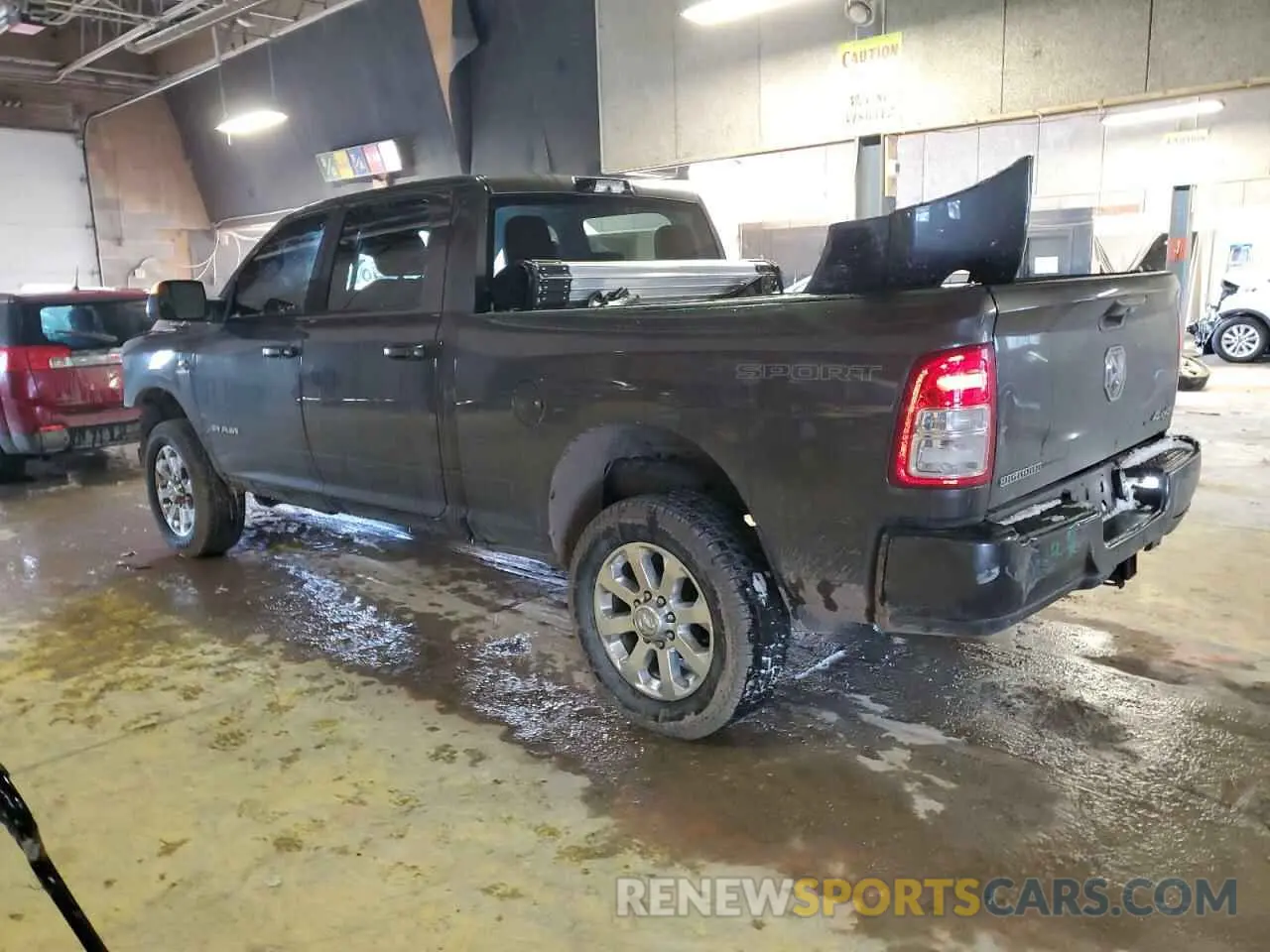 2 Photograph of a damaged car 3C6UR5DL3NG171067 RAM 2500 2022