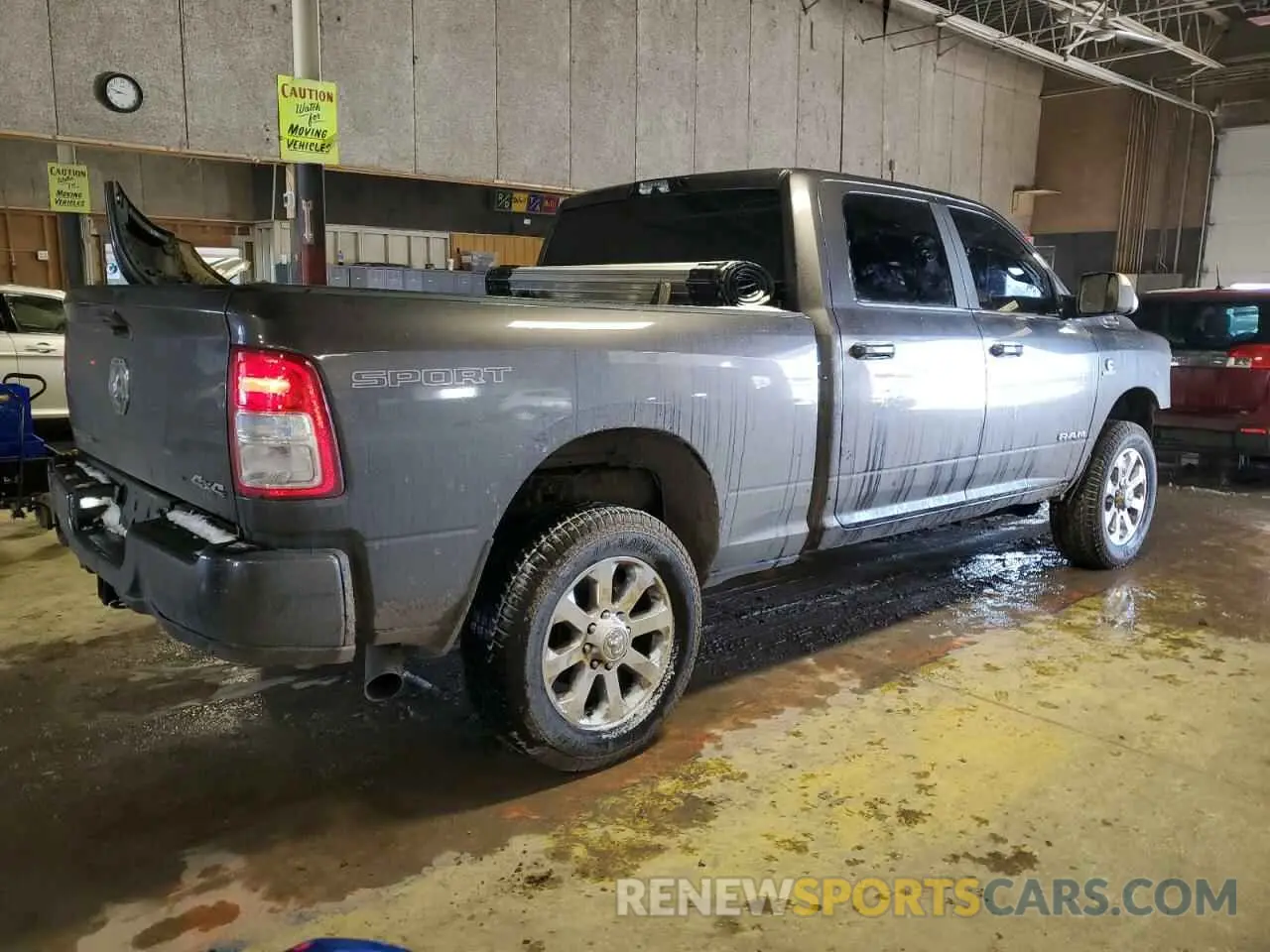 3 Photograph of a damaged car 3C6UR5DL3NG171067 RAM 2500 2022