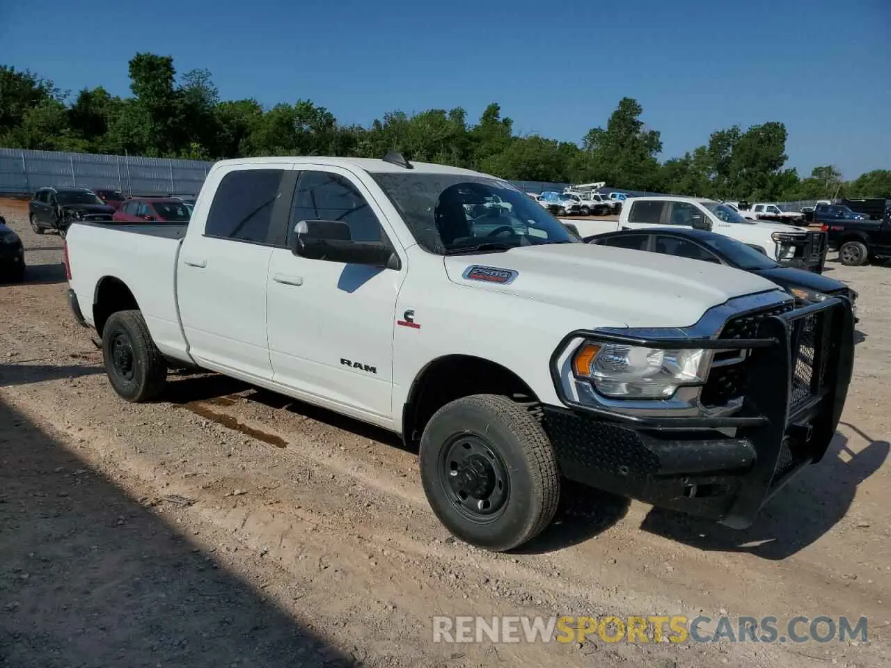 4 Photograph of a damaged car 3C6UR5DL3NG322697 RAM 2500 2022