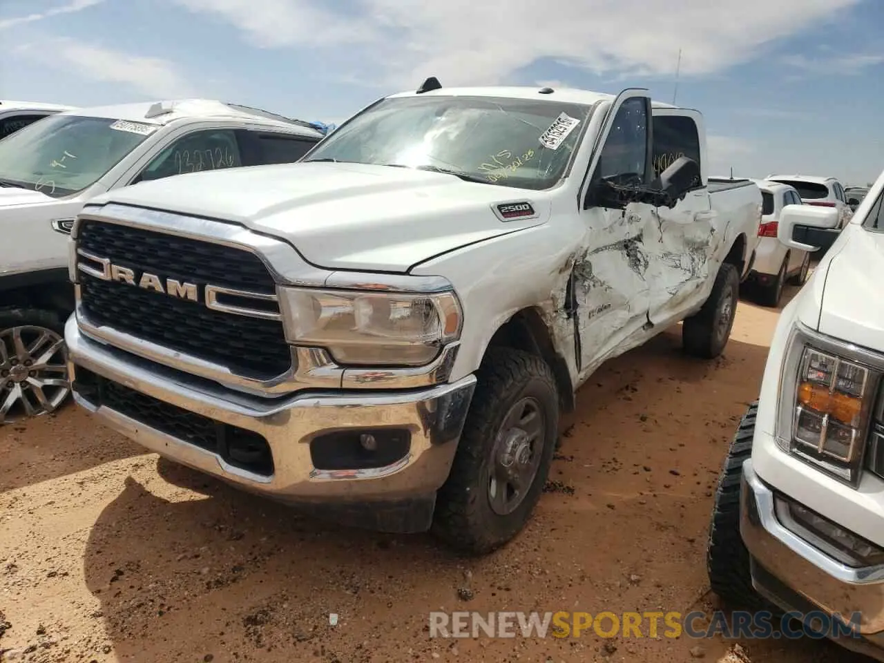 1 Photograph of a damaged car 3C6UR5DL3NG441138 RAM 2500 2022