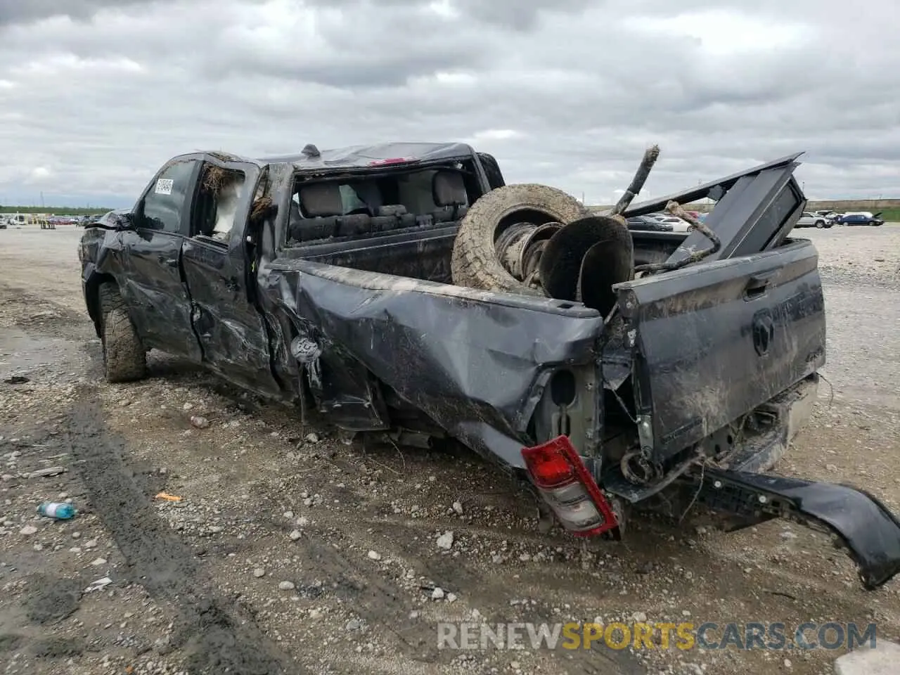 2 Photograph of a damaged car 3C6UR5DL4NG185799 RAM 2500 2022