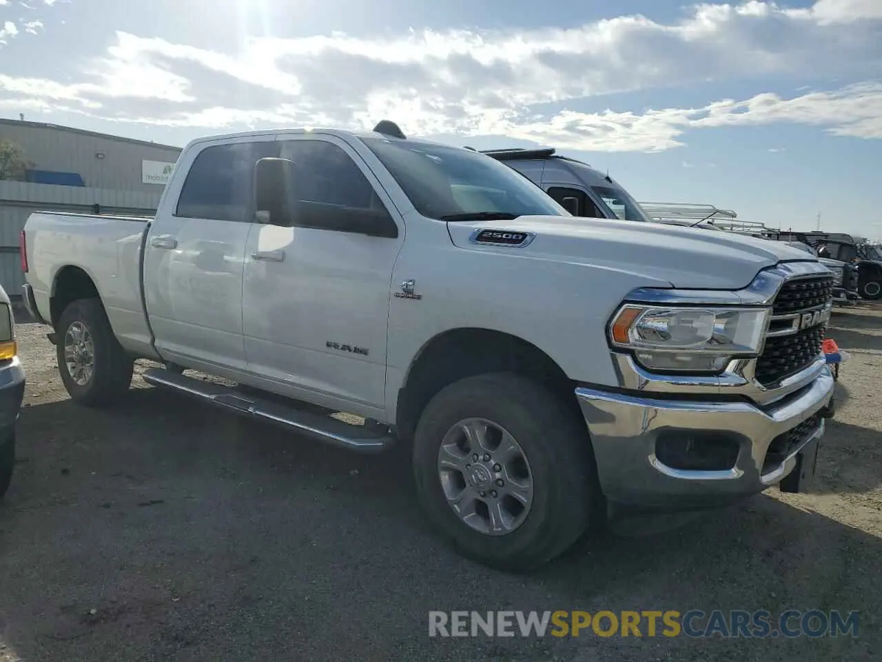 4 Photograph of a damaged car 3C6UR5DL4NG271534 RAM 2500 2022