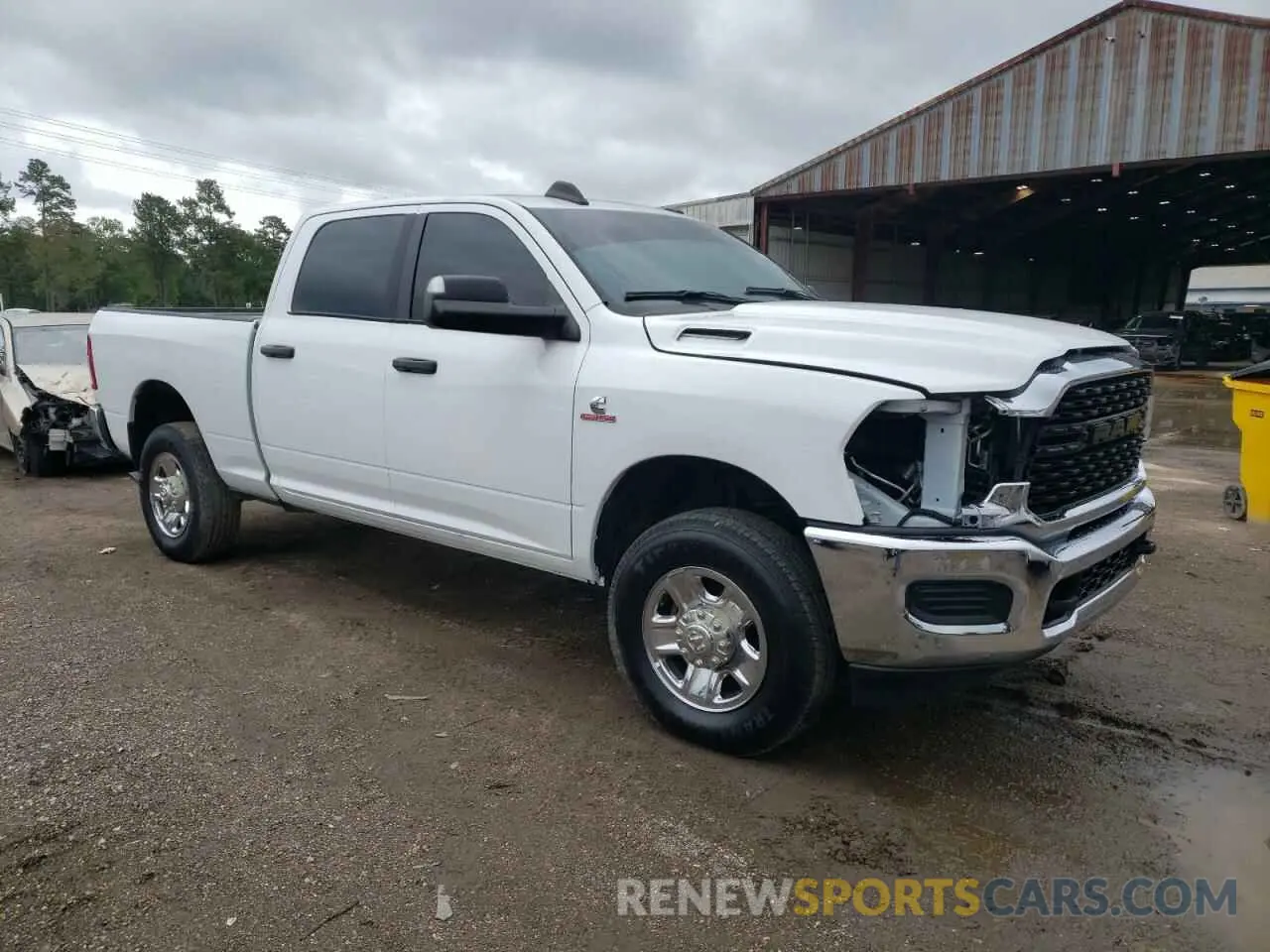 4 Photograph of a damaged car 3C6UR5DL4NG422033 RAM 2500 2022