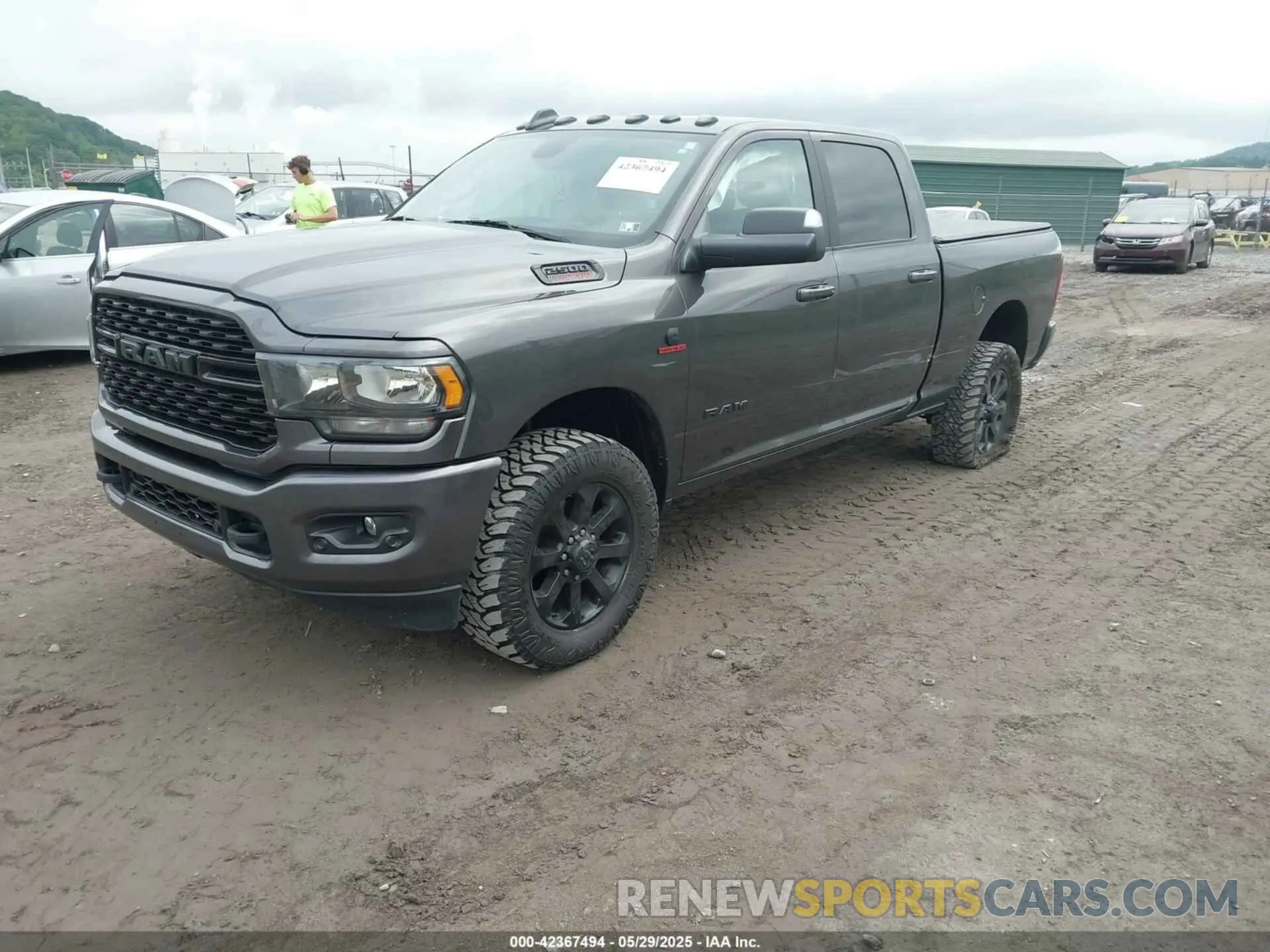 2 Photograph of a damaged car 3C6UR5DL5NG209298 RAM 2500 2022