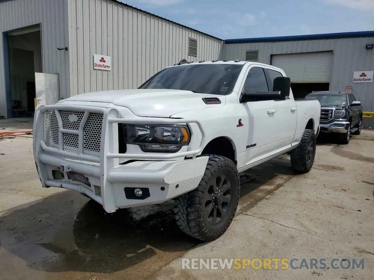 1 Photograph of a damaged car 3C6UR5DL5NG394811 RAM 2500 2022