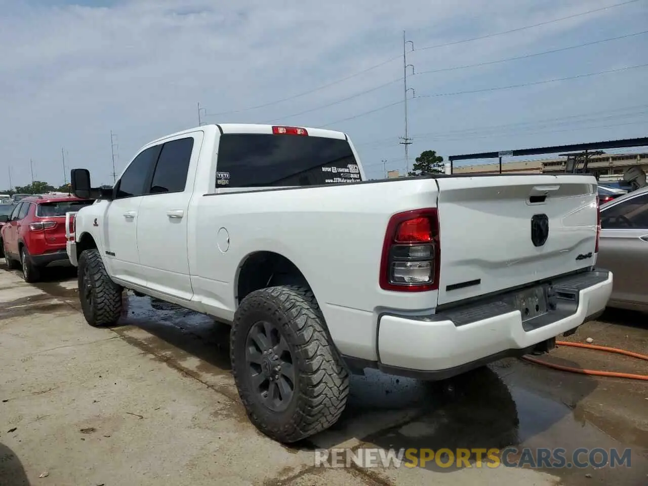 2 Photograph of a damaged car 3C6UR5DL5NG394811 RAM 2500 2022