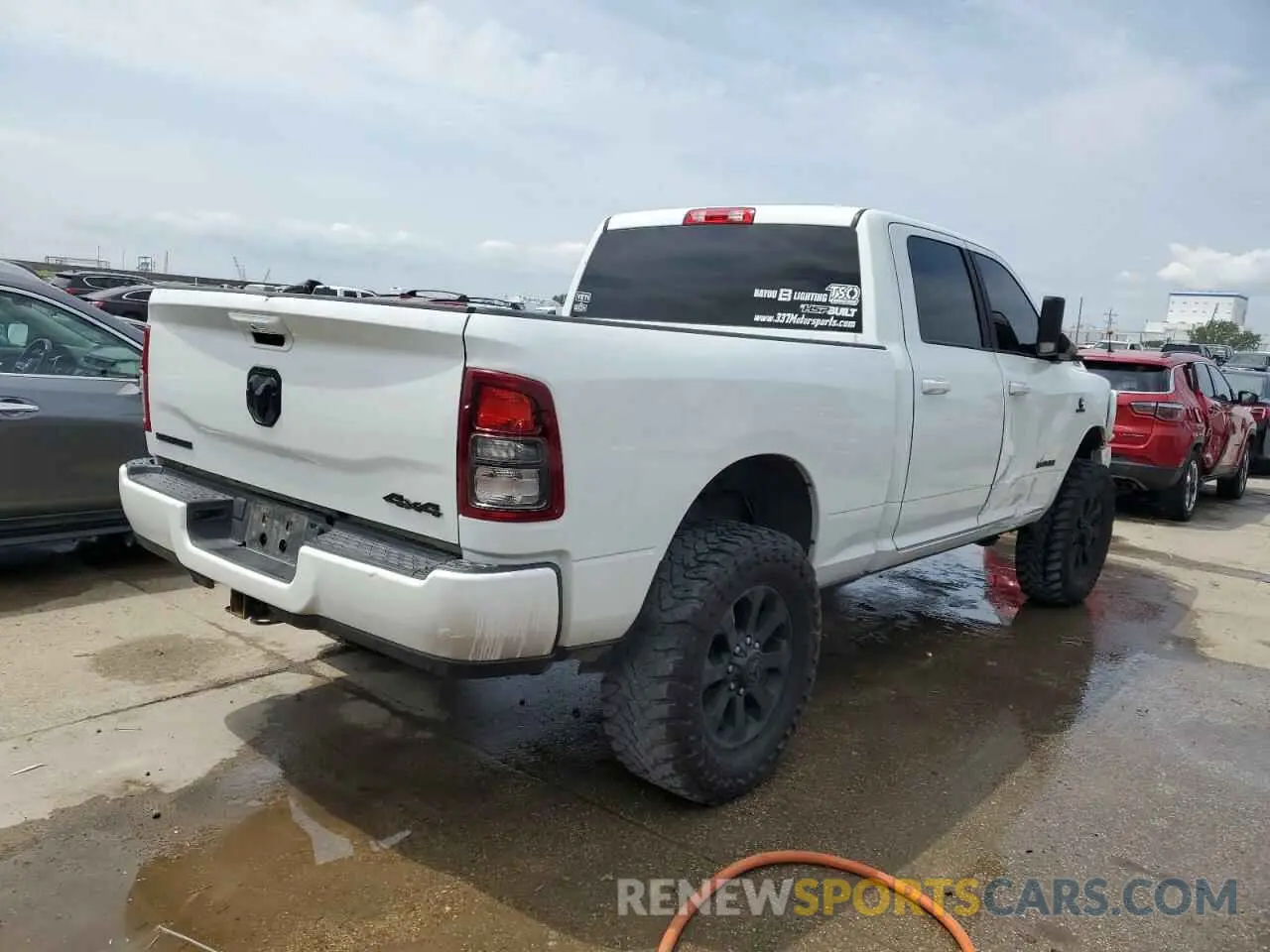 3 Photograph of a damaged car 3C6UR5DL5NG394811 RAM 2500 2022