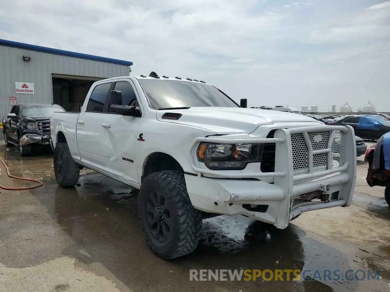 4 Photograph of a damaged car 3C6UR5DL5NG394811 RAM 2500 2022