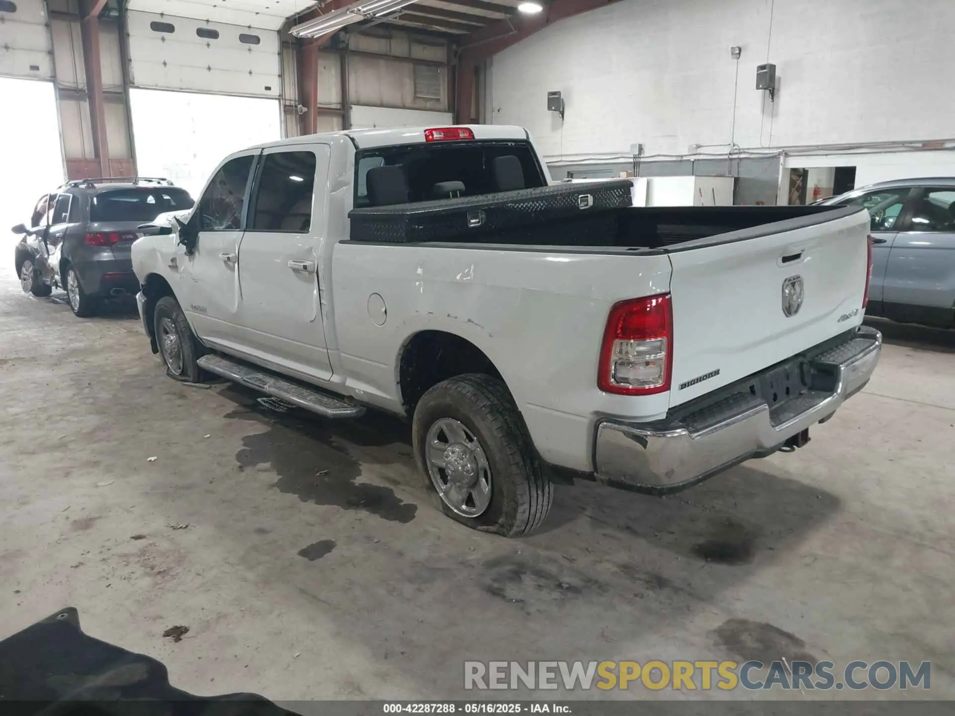 3 Photograph of a damaged car 3C6UR5DL6NG436791 RAM 2500 2022