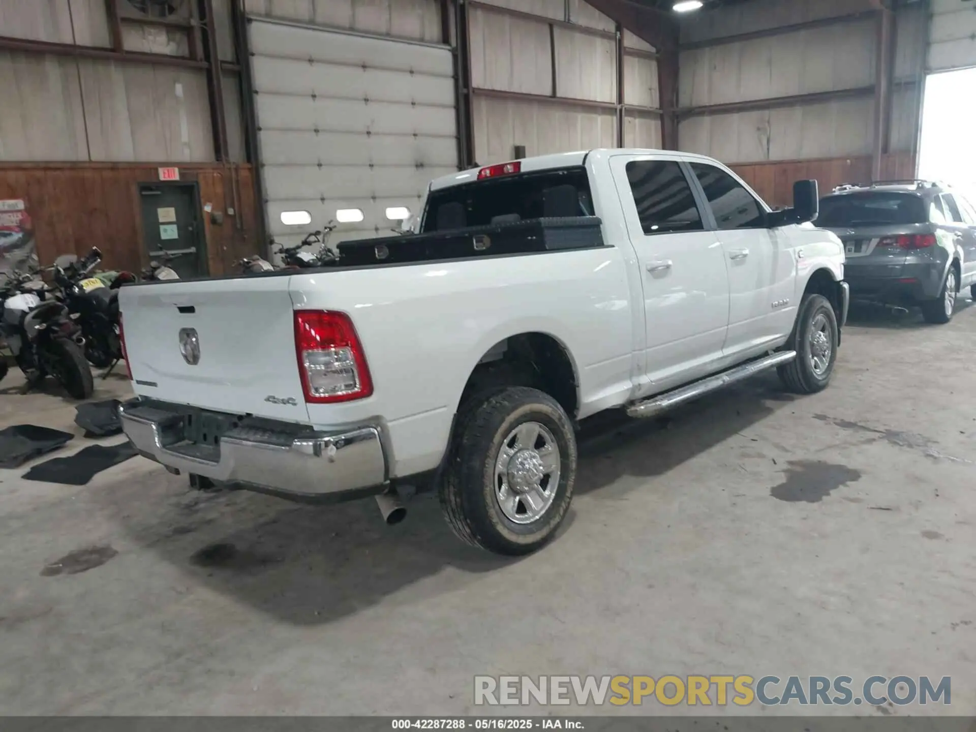 4 Photograph of a damaged car 3C6UR5DL6NG436791 RAM 2500 2022