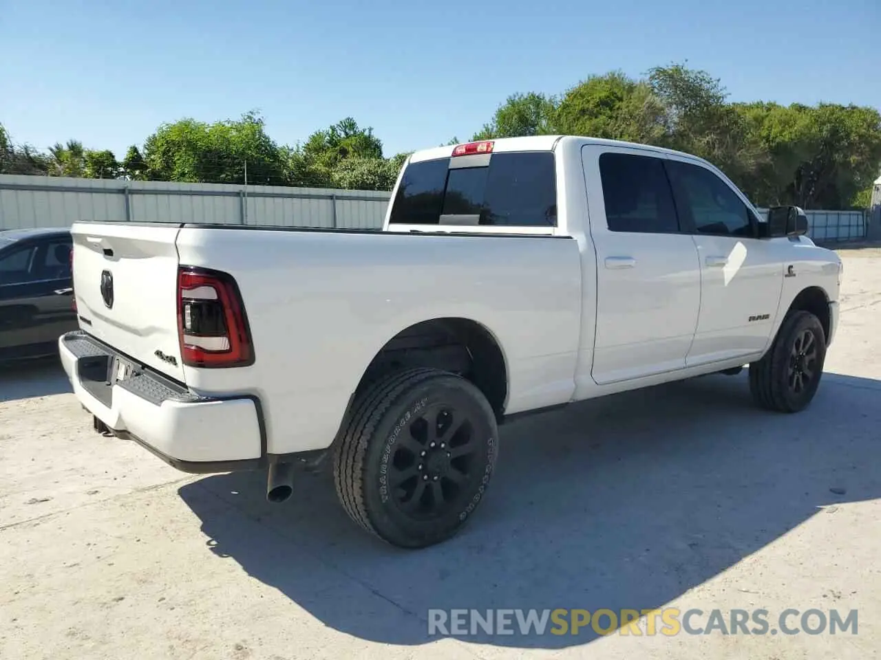 3 Photograph of a damaged car 3C6UR5DL7NG109526 RAM 2500 2022