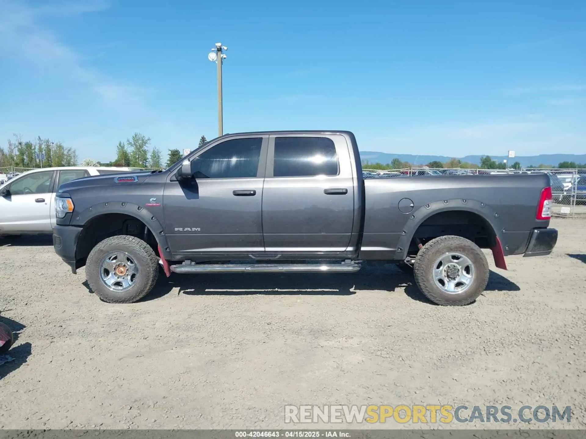 14 Photograph of a damaged car 3C6UR5DL8NG324154 RAM 2500 2022