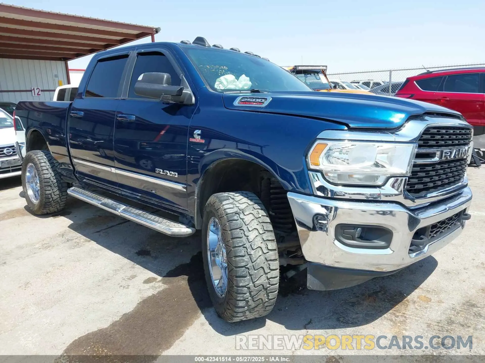 1 Photograph of a damaged car 3C6UR5DL9NG149414 RAM 2500 2022