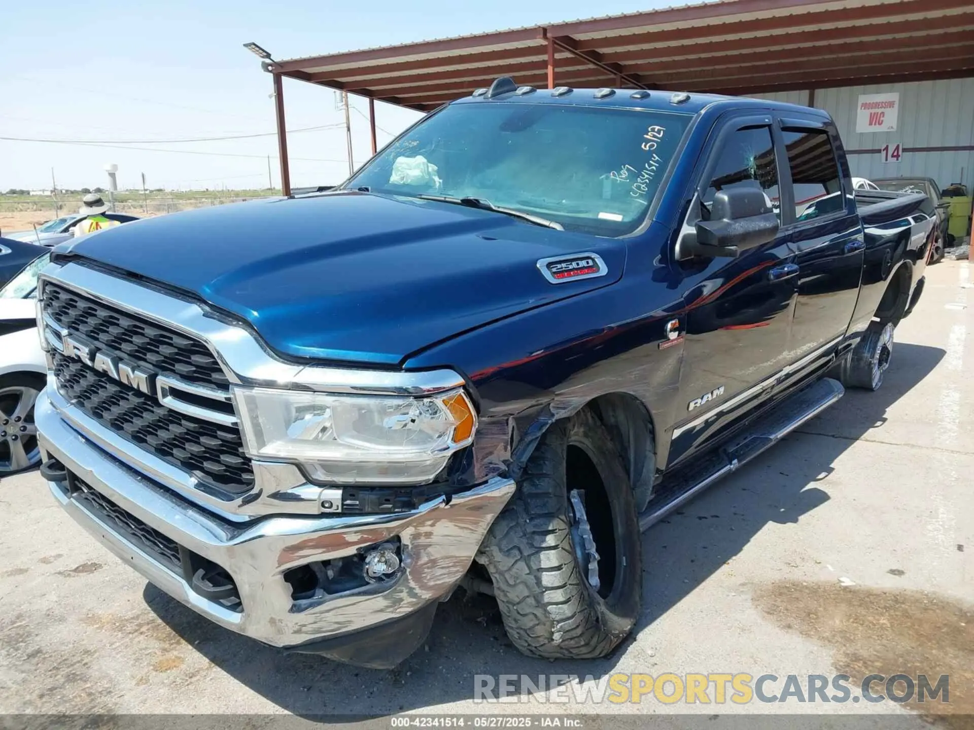 2 Photograph of a damaged car 3C6UR5DL9NG149414 RAM 2500 2022