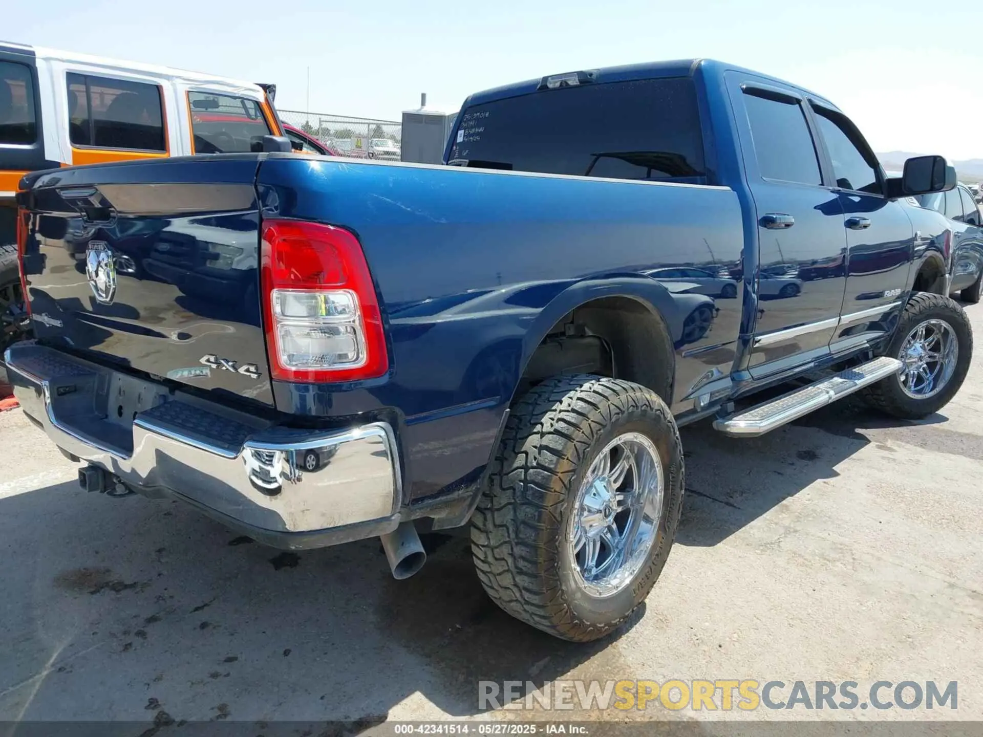 4 Photograph of a damaged car 3C6UR5DL9NG149414 RAM 2500 2022