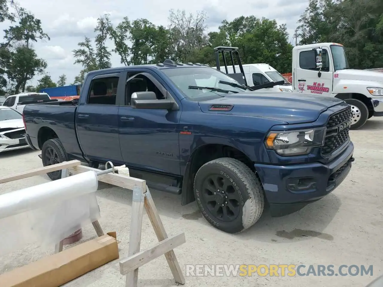 4 Photograph of a damaged car 3C6UR5DL9NG149946 RAM 2500 2022