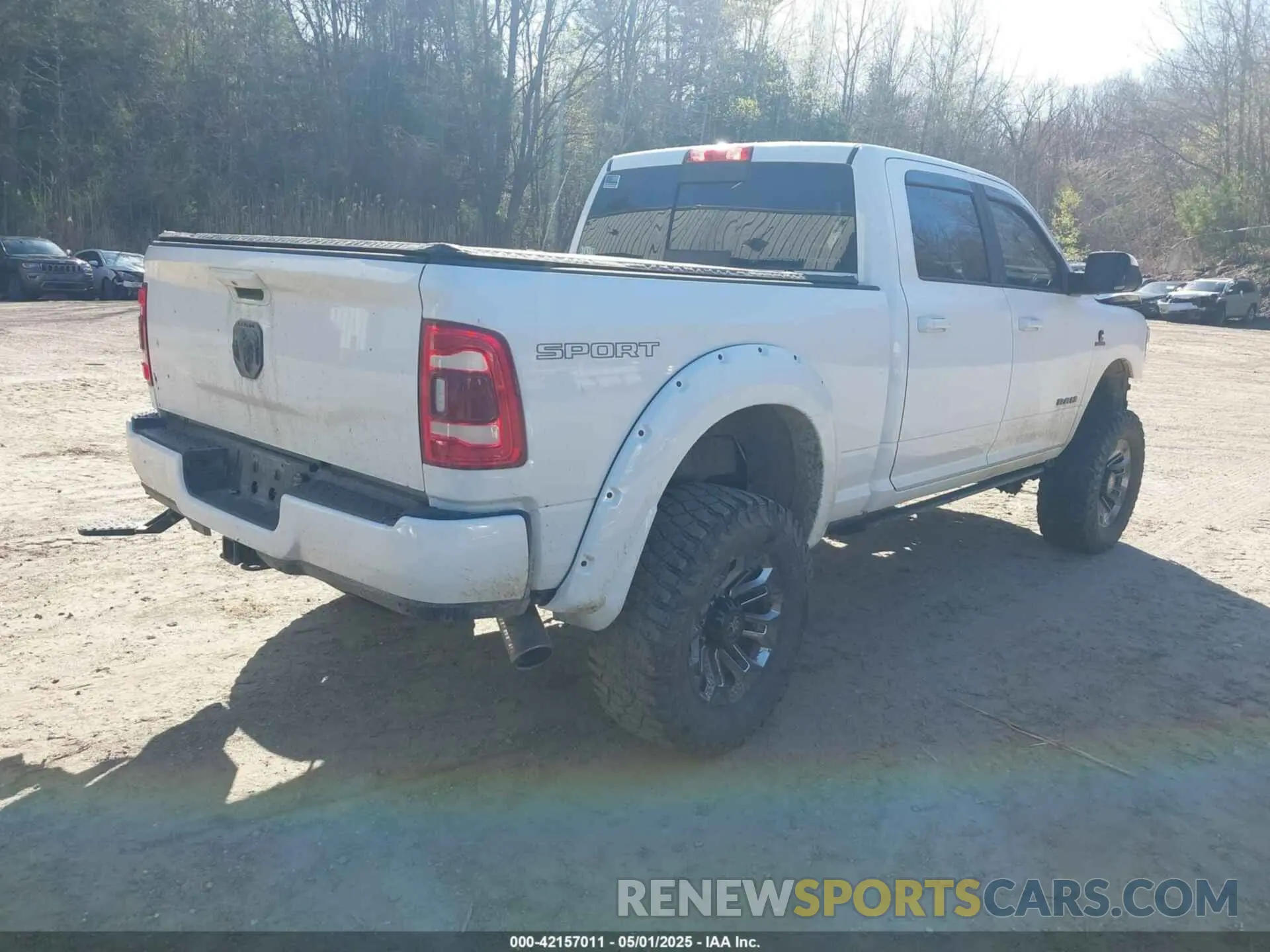 4 Photograph of a damaged car 3C6UR5DL9NG169775 RAM 2500 2022