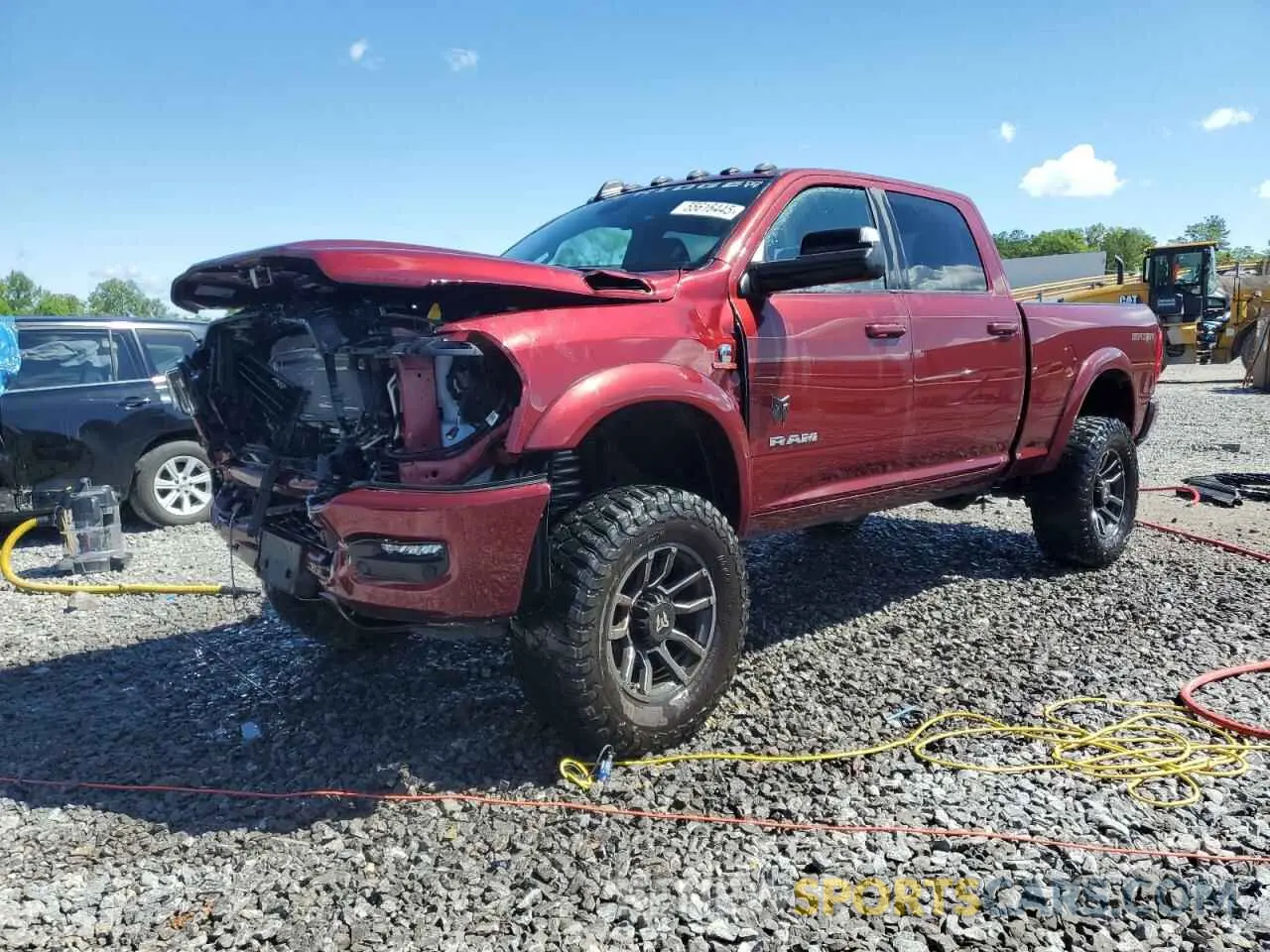 1 Photograph of a damaged car 3C6UR5DL9NG185880 RAM 2500 2022