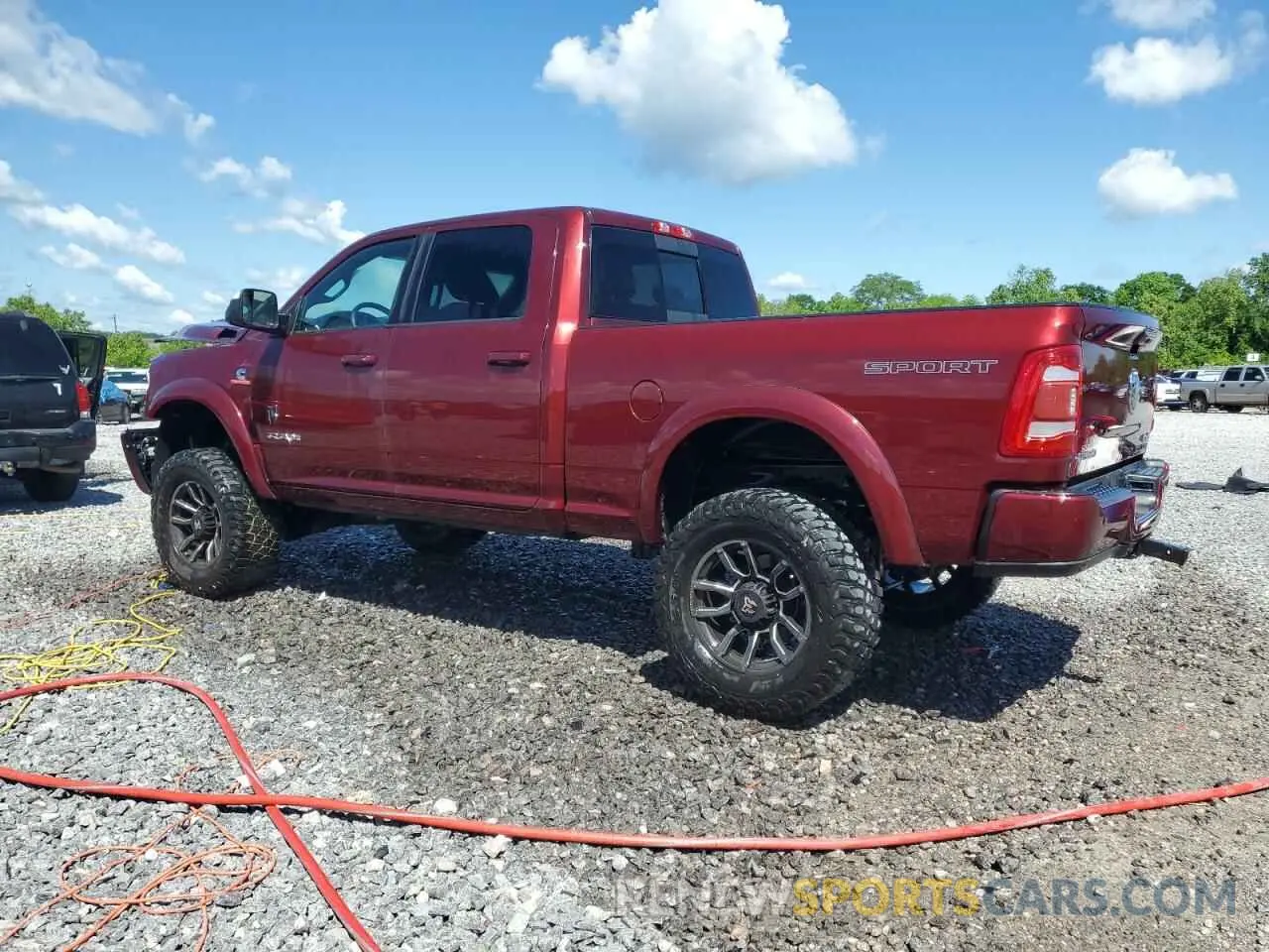 2 Photograph of a damaged car 3C6UR5DL9NG185880 RAM 2500 2022