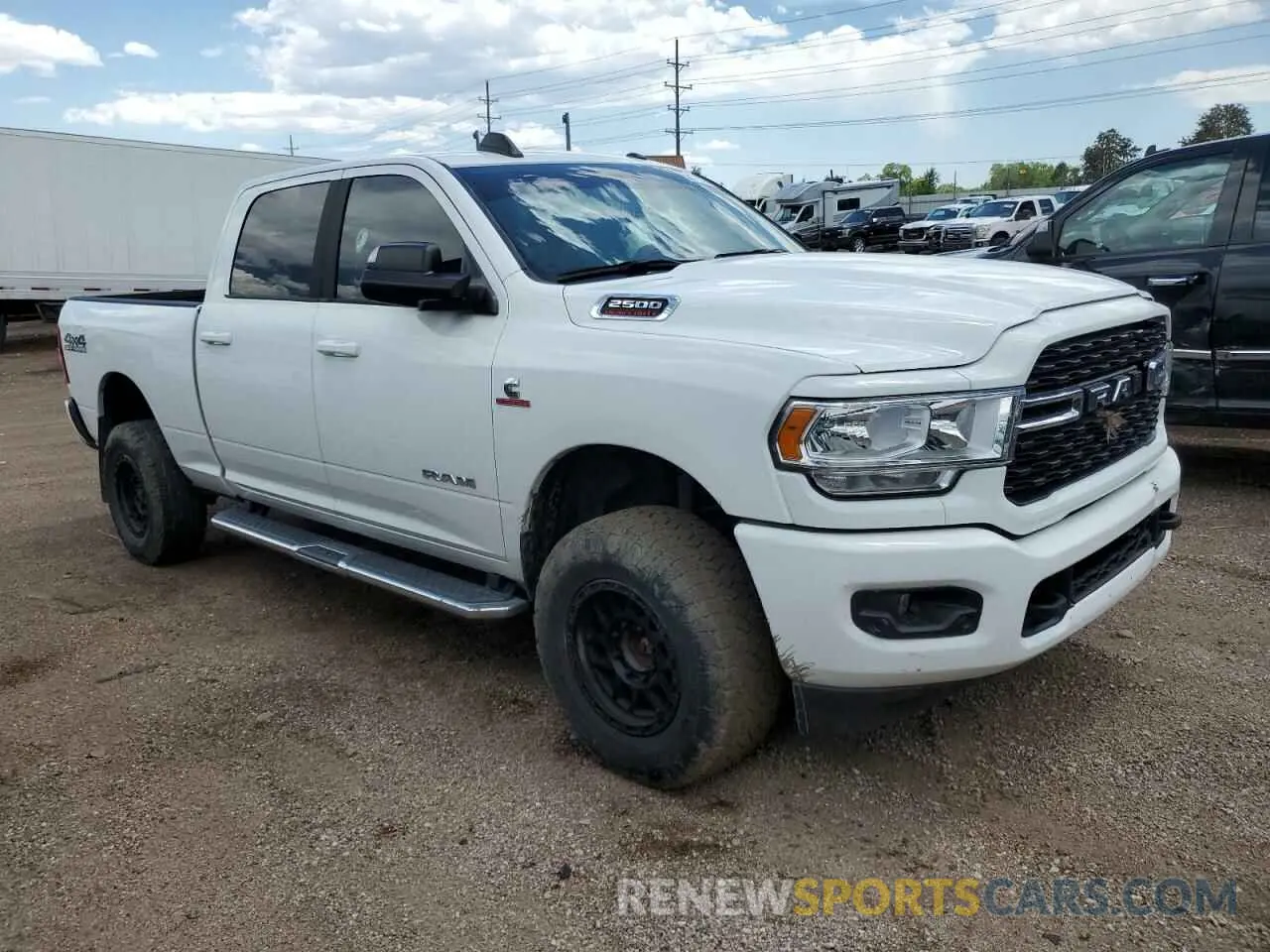 4 Photograph of a damaged car 3C6UR5DLXNG183393 RAM 2500 2022