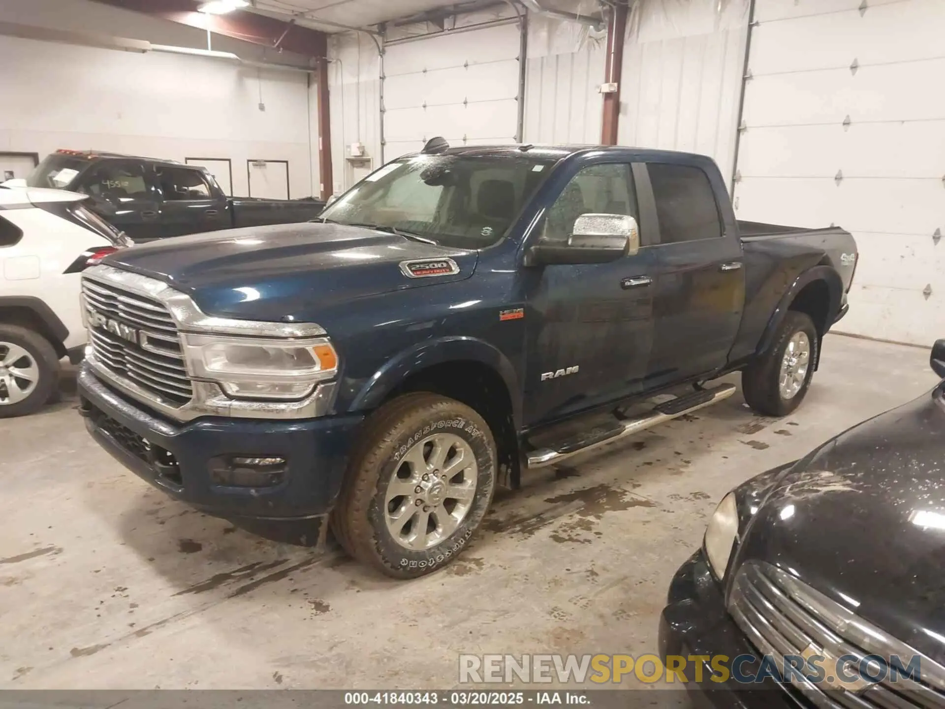 2 Photograph of a damaged car 3C6UR5FJ0NG370184 RAM 2500 2022