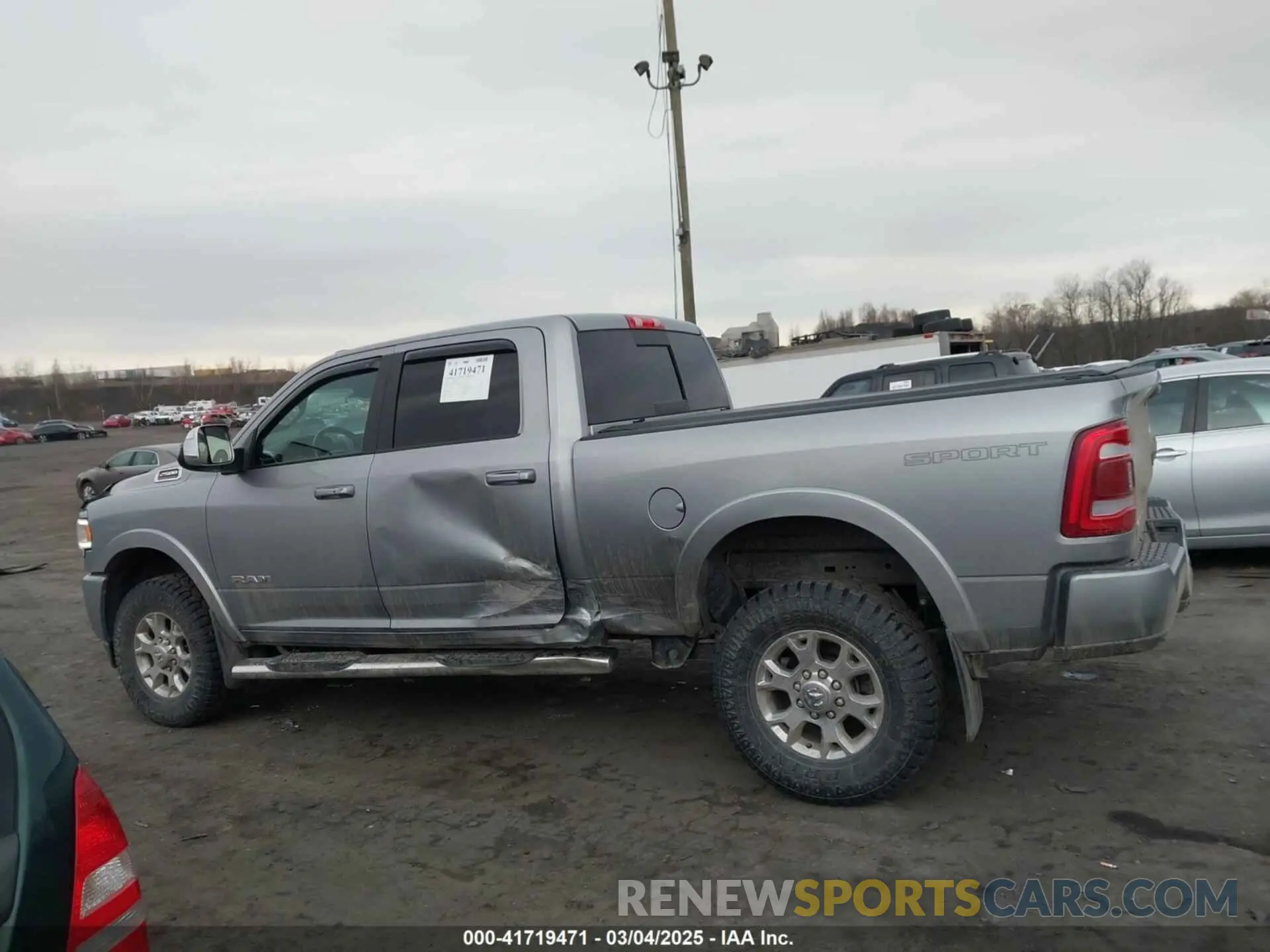 14 Photograph of a damaged car 3C6UR5FJ1NG230435 RAM 2500 2022