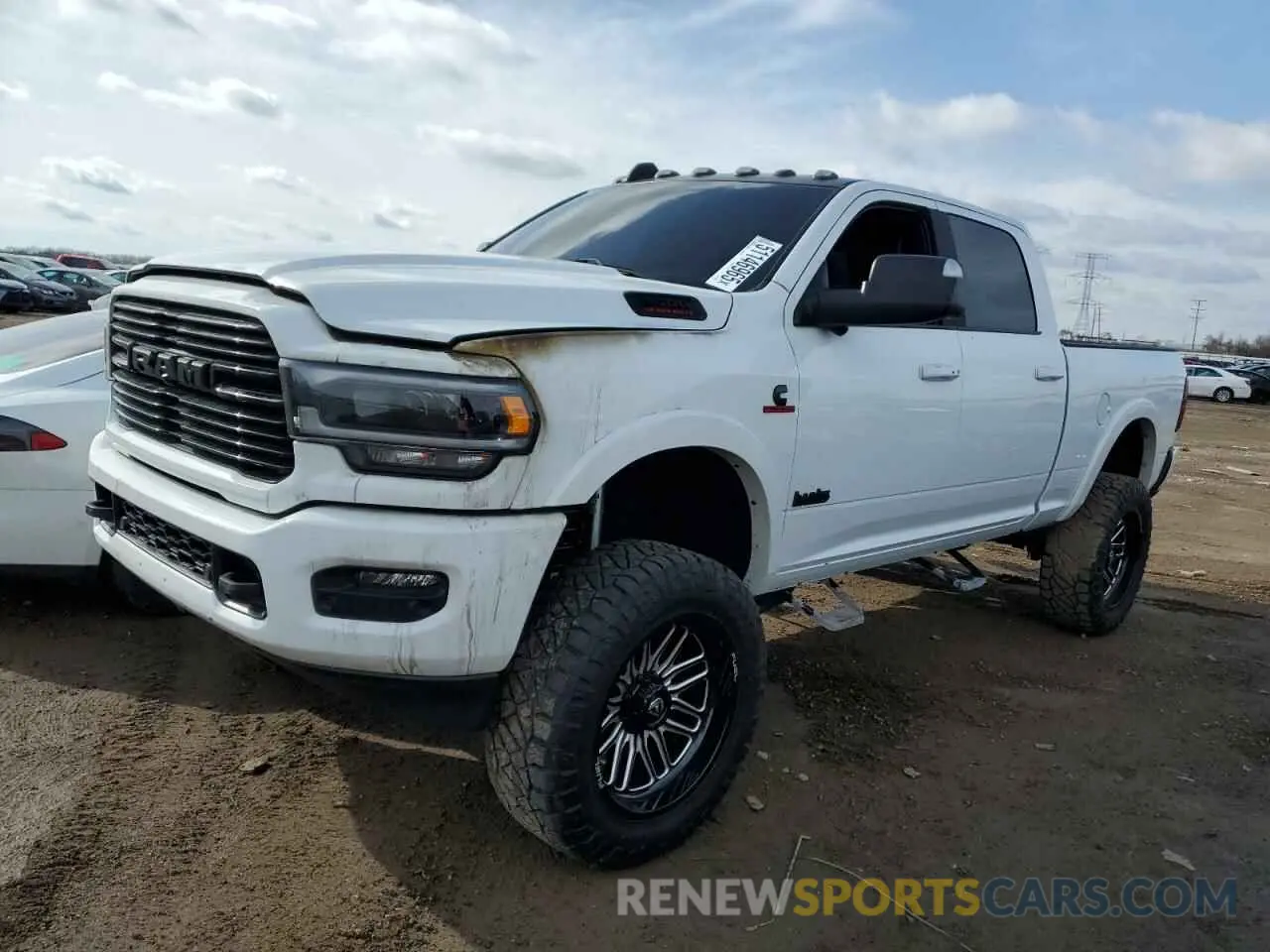1 Photograph of a damaged car 3C6UR5FL5NG299405 RAM 2500 2022