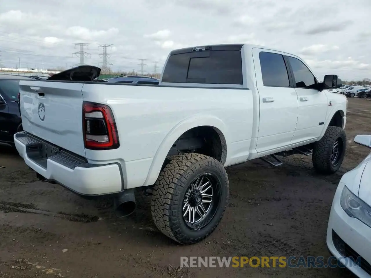 3 Photograph of a damaged car 3C6UR5FL5NG299405 RAM 2500 2022