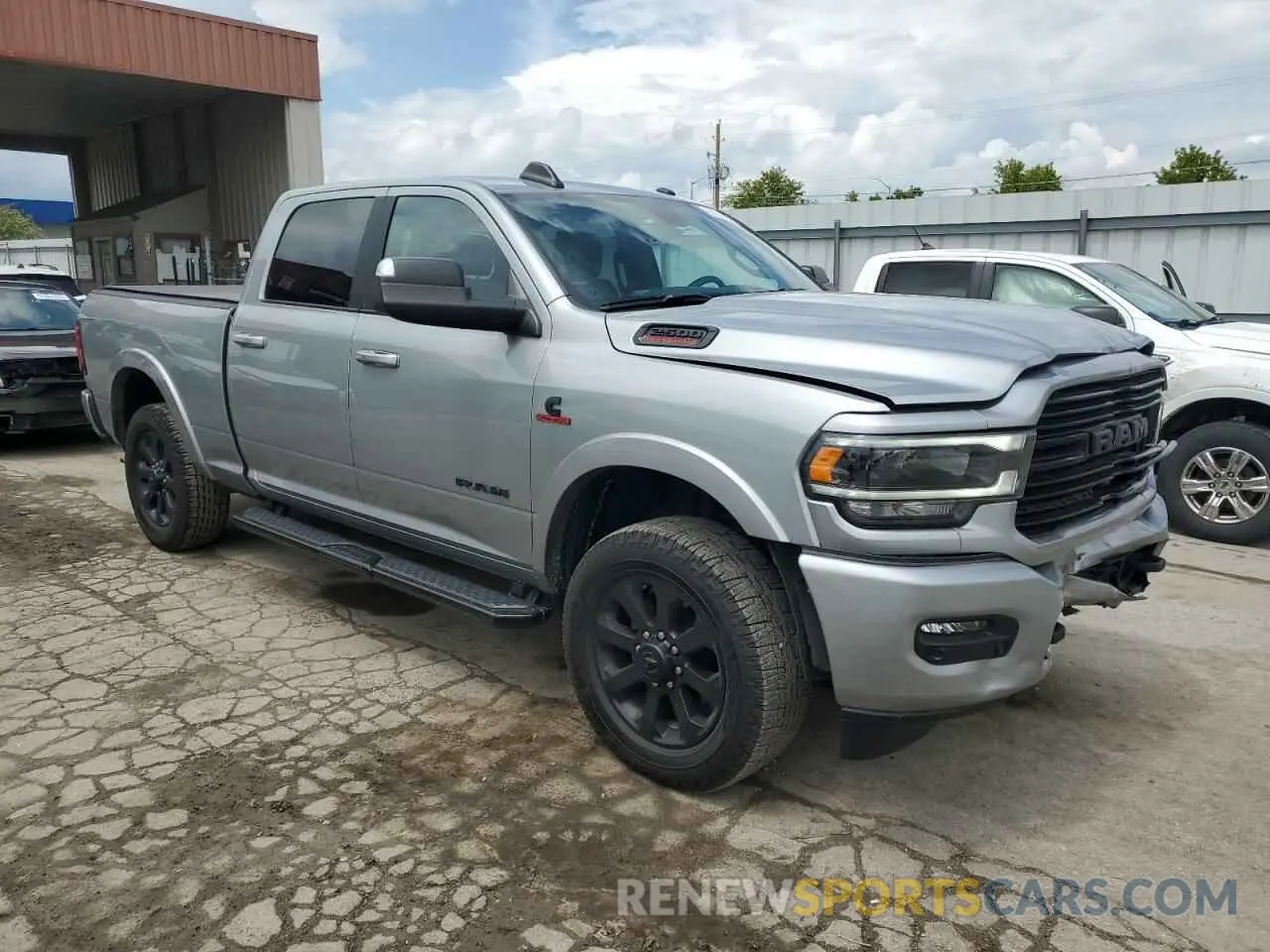 4 Photograph of a damaged car 3C6UR5FL6NG261617 RAM 2500 2022