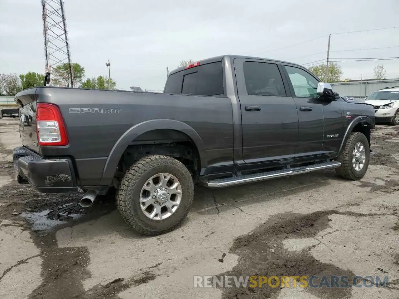 3 Photograph of a damaged car 3C6UR5FL7NG282931 RAM 2500 2022