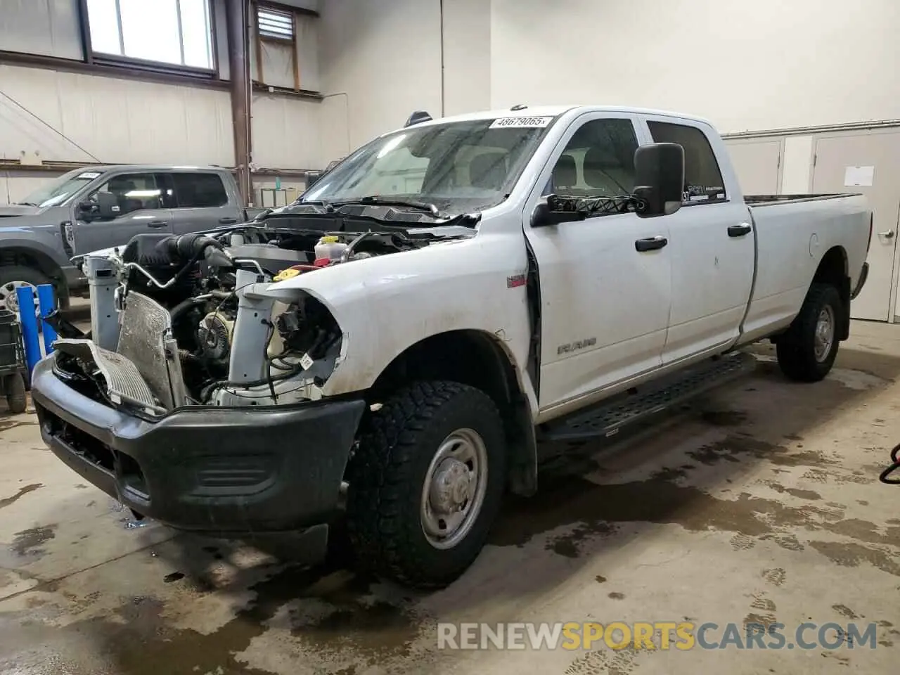 1 Photograph of a damaged car 3C6UR5HJ3NG365610 RAM 2500 2022
