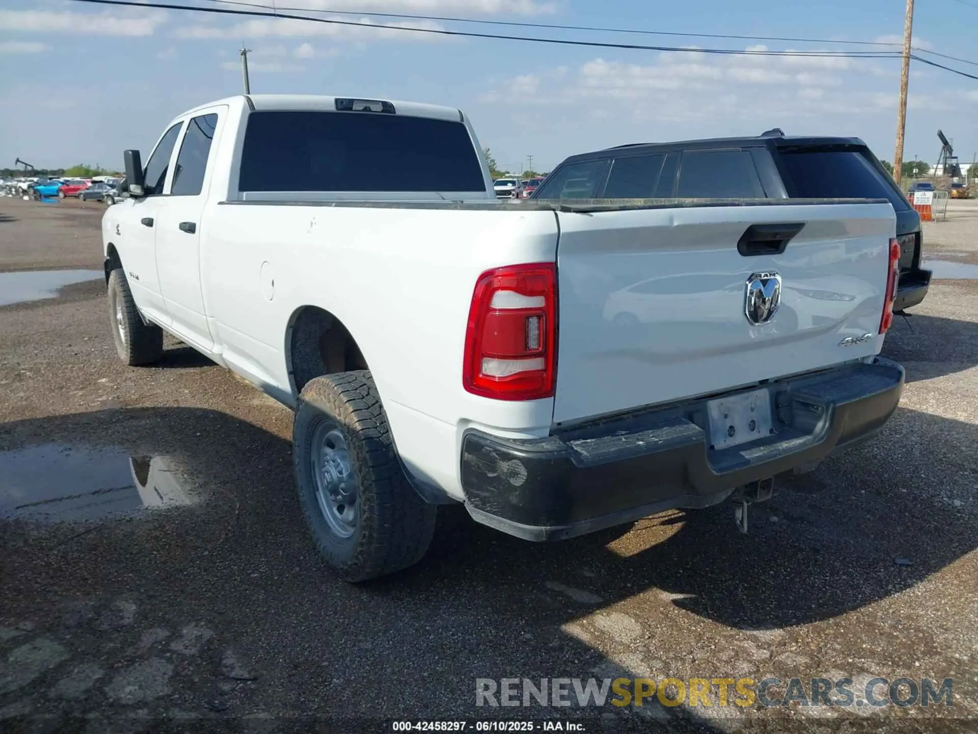 3 Photograph of a damaged car 3C6UR5HL8NG202498 RAM 2500 2022
