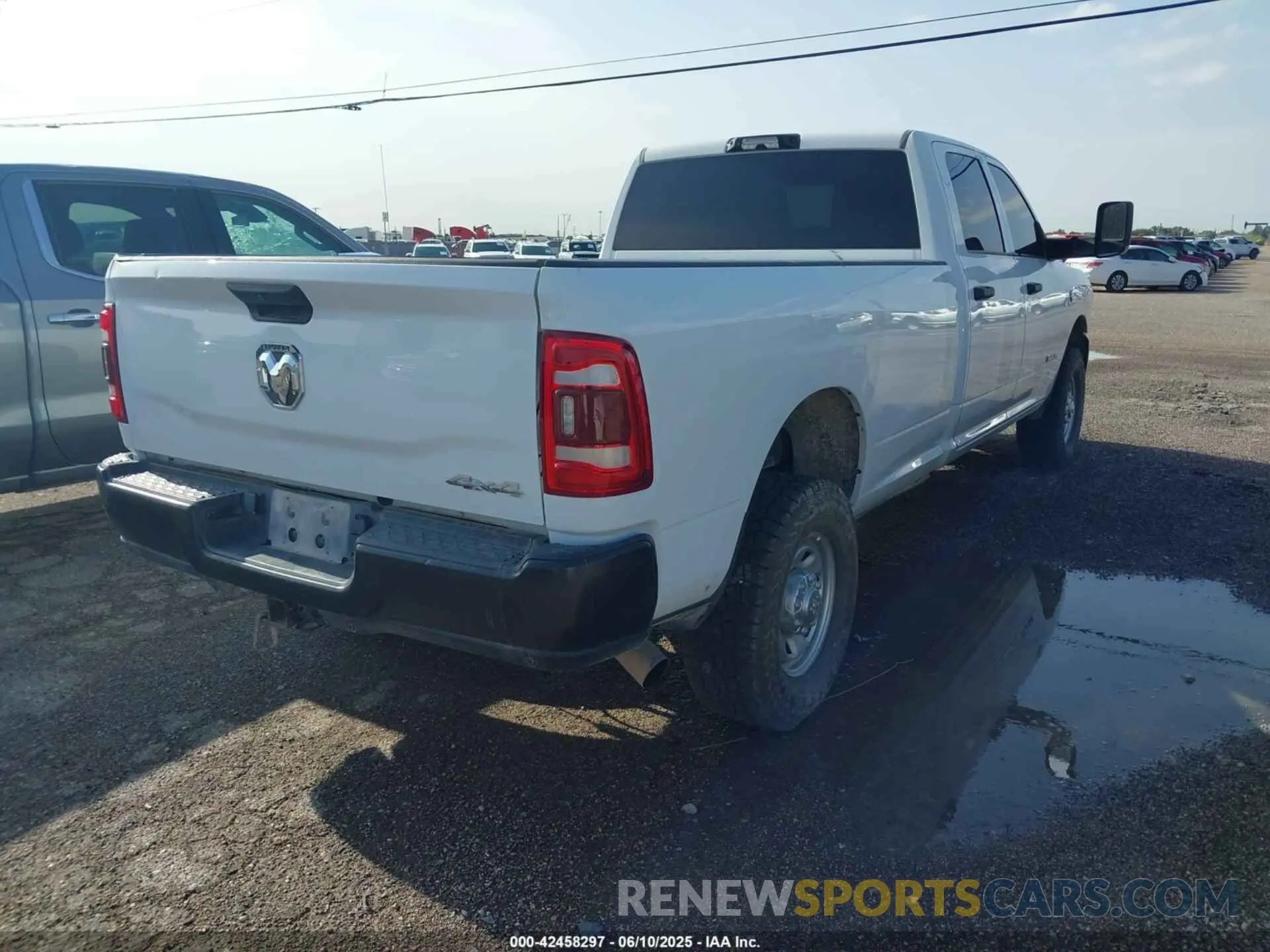 4 Photograph of a damaged car 3C6UR5HL8NG202498 RAM 2500 2022