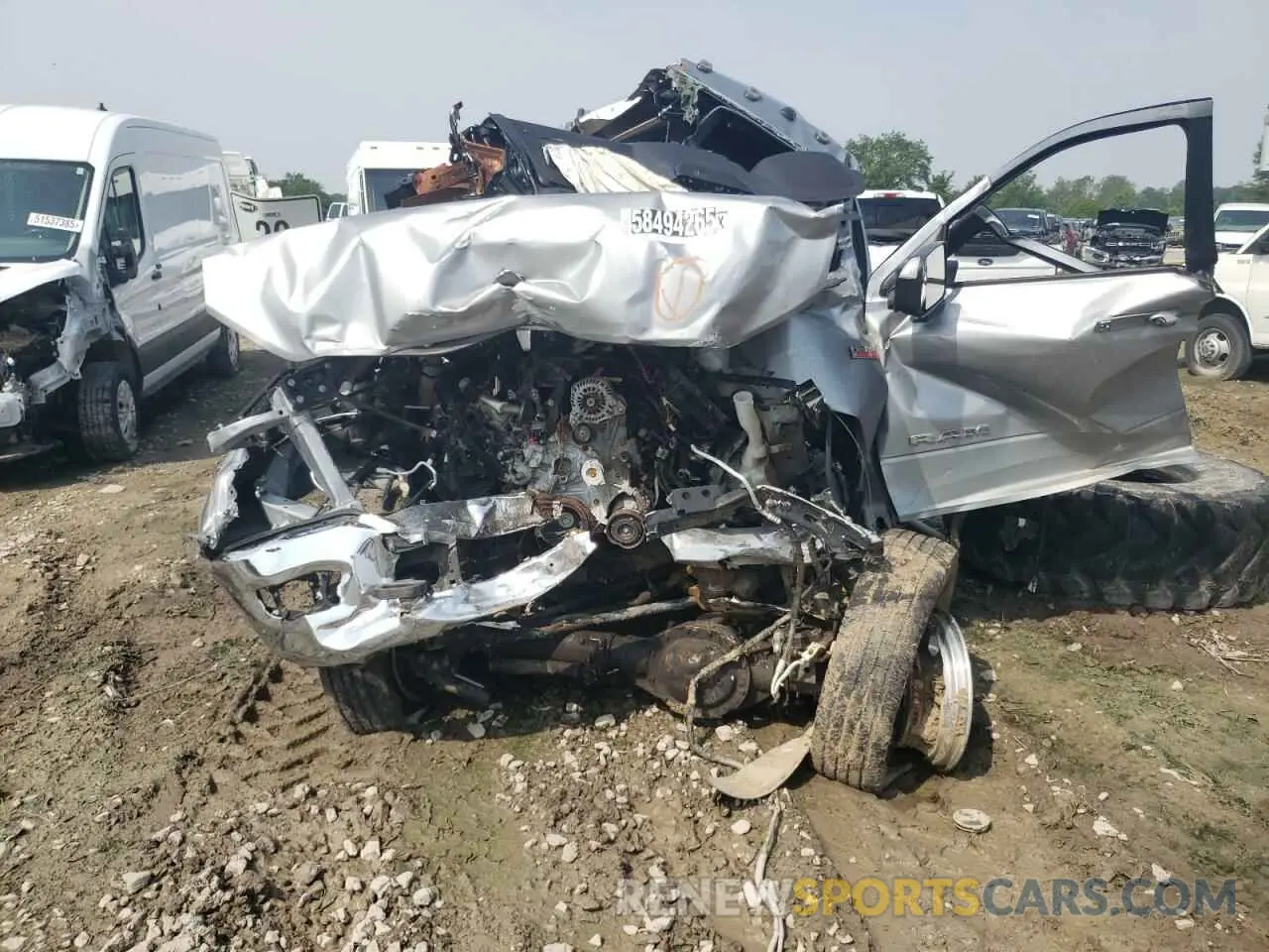 5 Photograph of a damaged car 3C6UR5JJ9NG305146 RAM 2500 2022