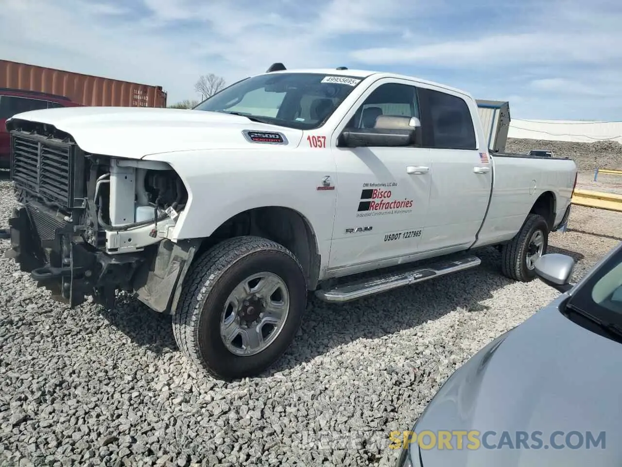 1 Photograph of a damaged car 3C6UR5JL1NG123958 RAM 2500 2022