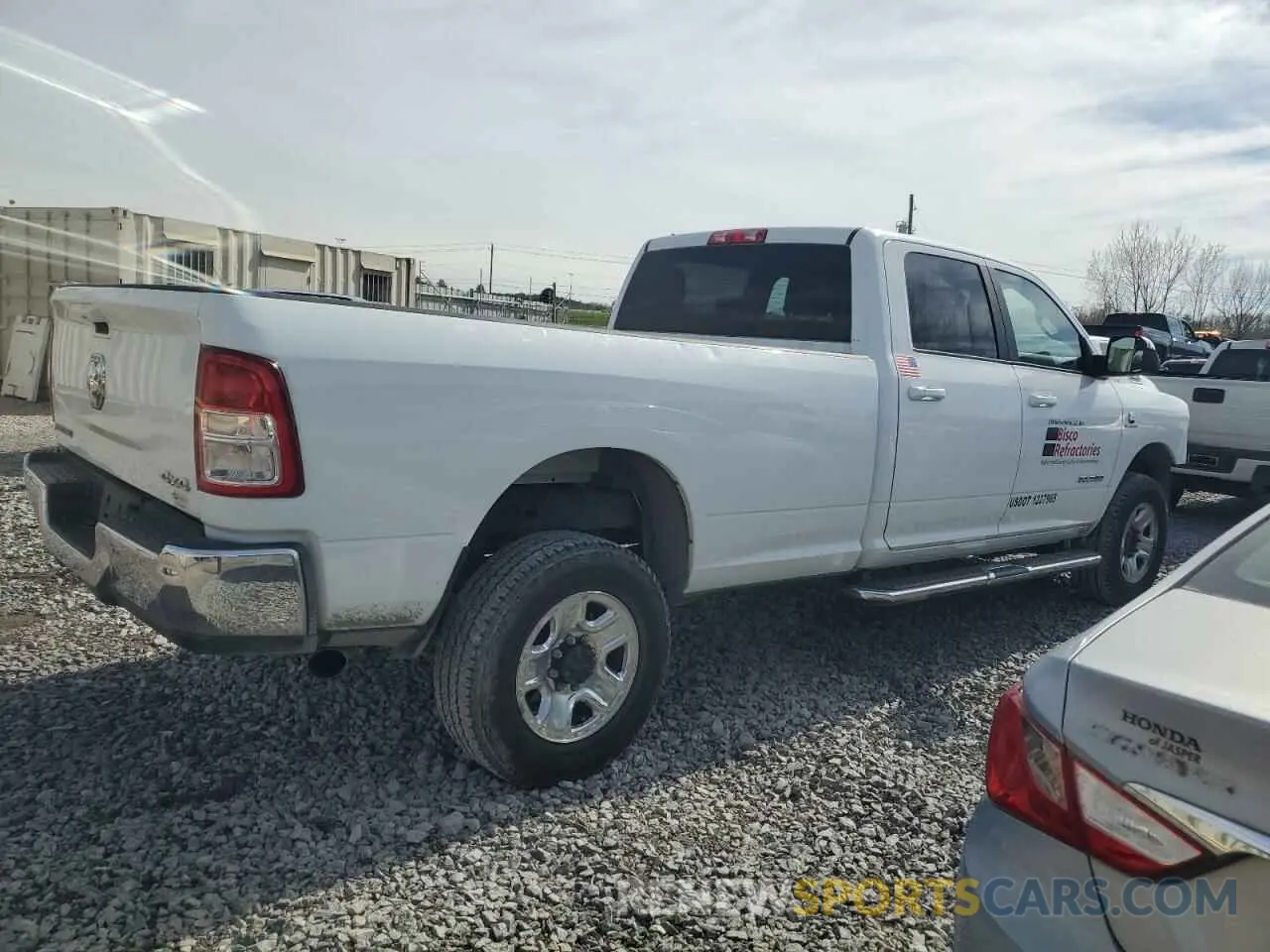 3 Photograph of a damaged car 3C6UR5JL1NG123958 RAM 2500 2022