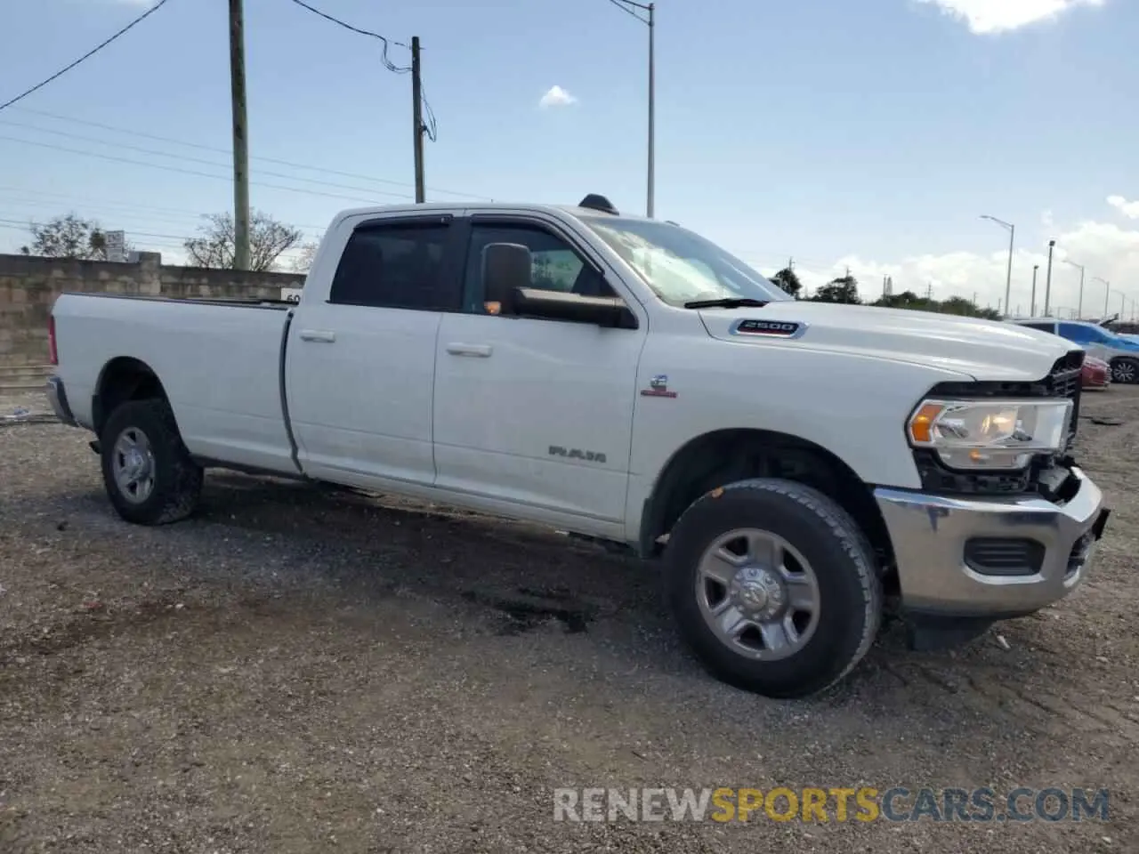 4 Photograph of a damaged car 3C6UR5JL3NG247441 RAM 2500 2022