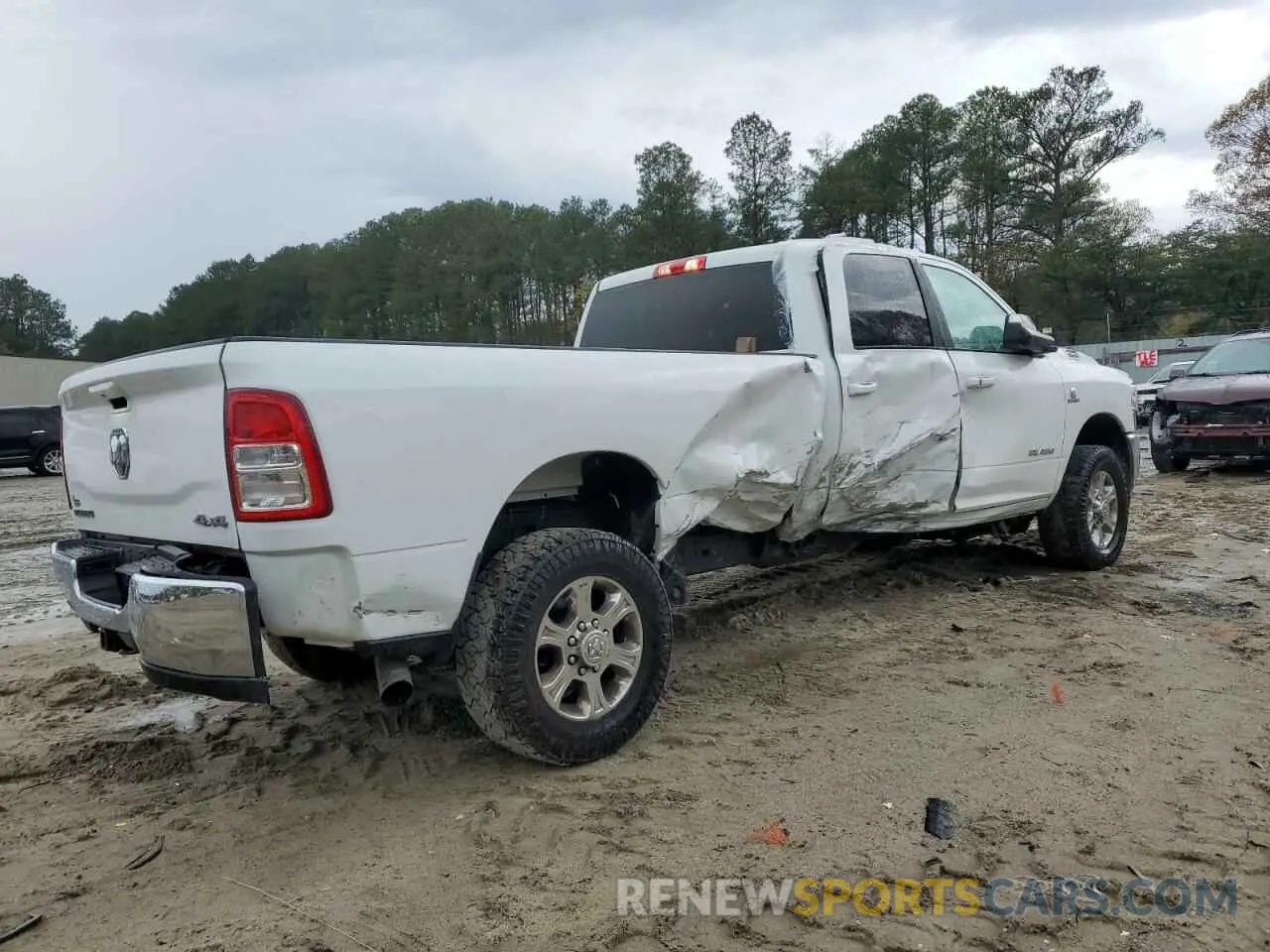 3 Photograph of a damaged car 3C6UR5JL4NG156579 RAM 2500 2022