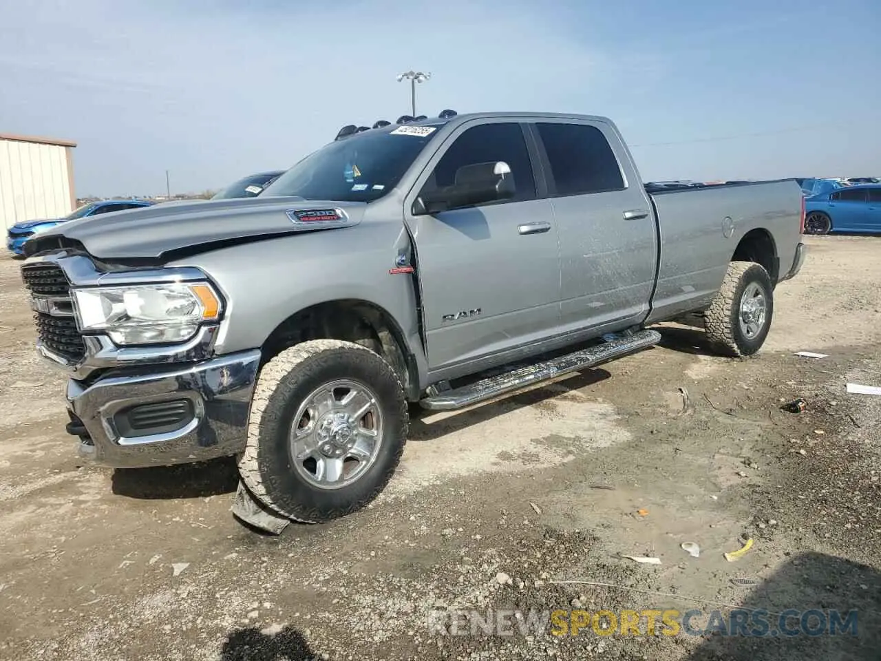 1 Photograph of a damaged car 3C6UR5JL8NG104064 RAM 2500 2022