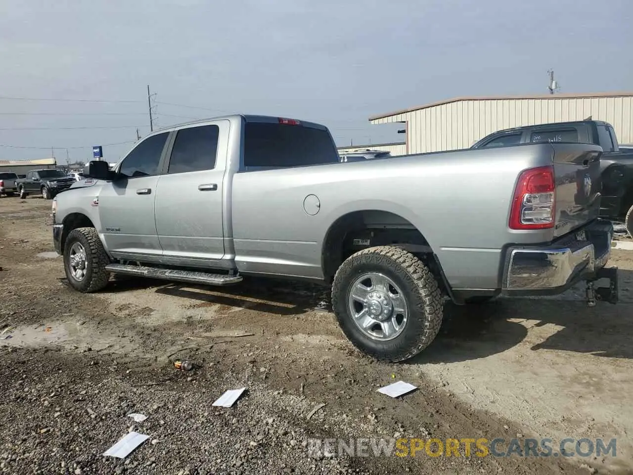 2 Photograph of a damaged car 3C6UR5JL8NG104064 RAM 2500 2022