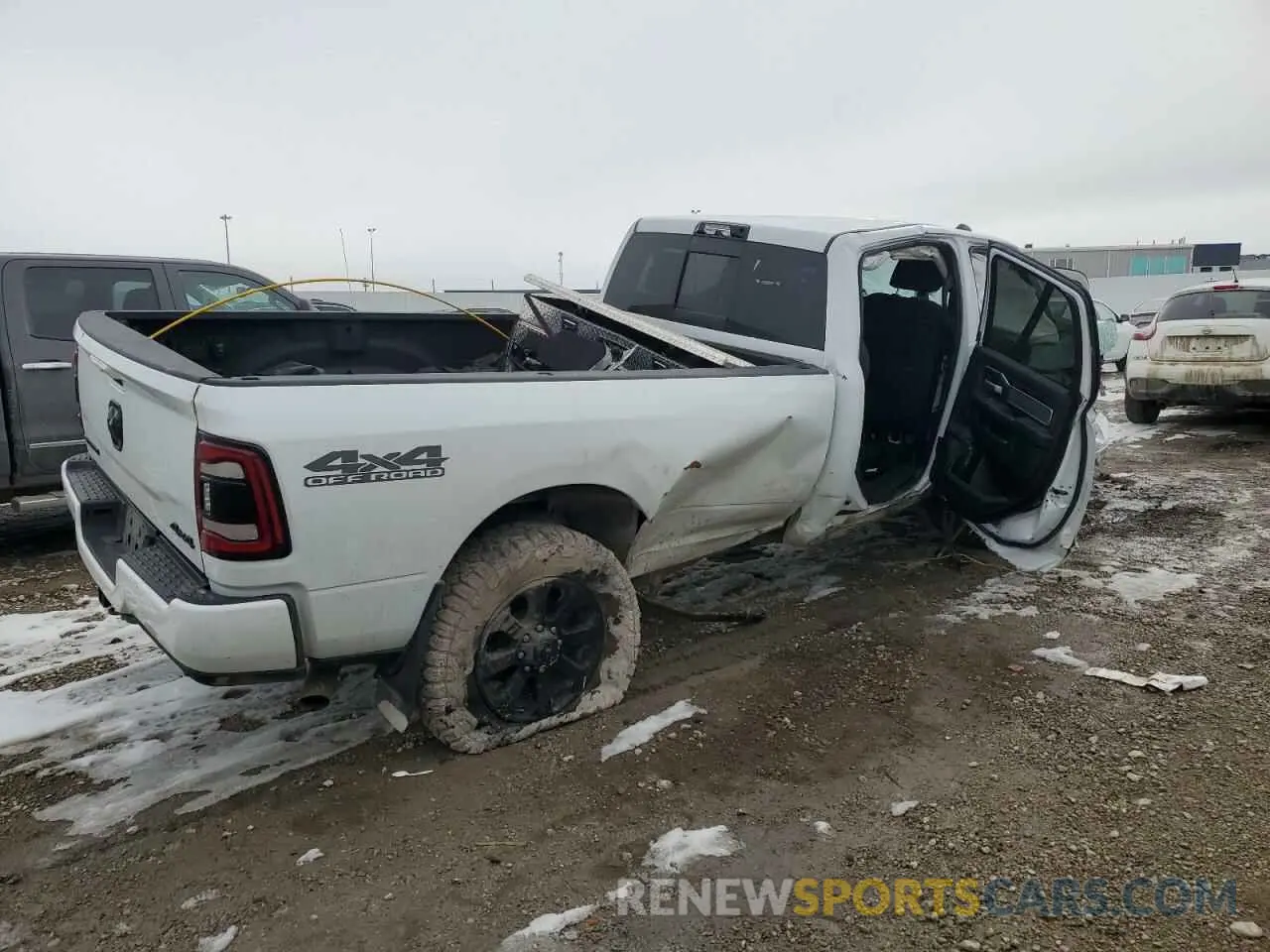 3 Photograph of a damaged car 3C6UR5JL9NG383024 RAM 2500 2022