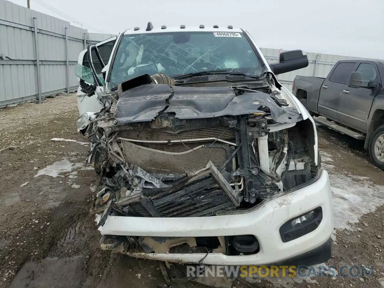 5 Photograph of a damaged car 3C6UR5JL9NG383024 RAM 2500 2022